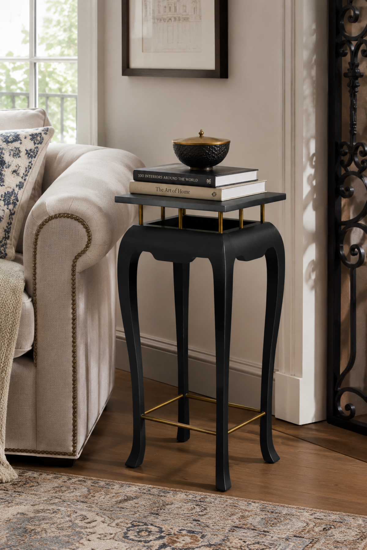 Black wooden plinth stand with brass detailing