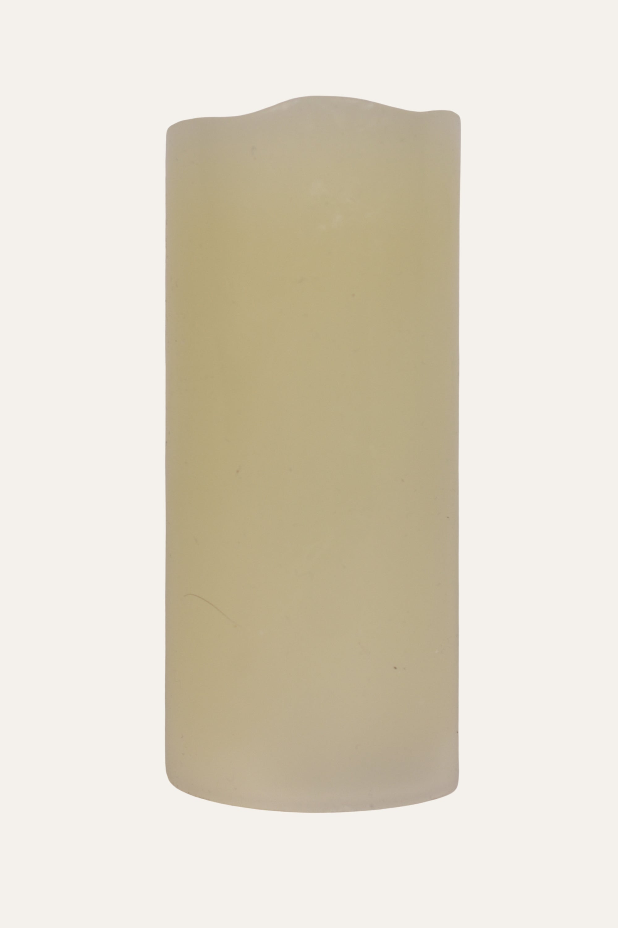 Beige cylindrical candle