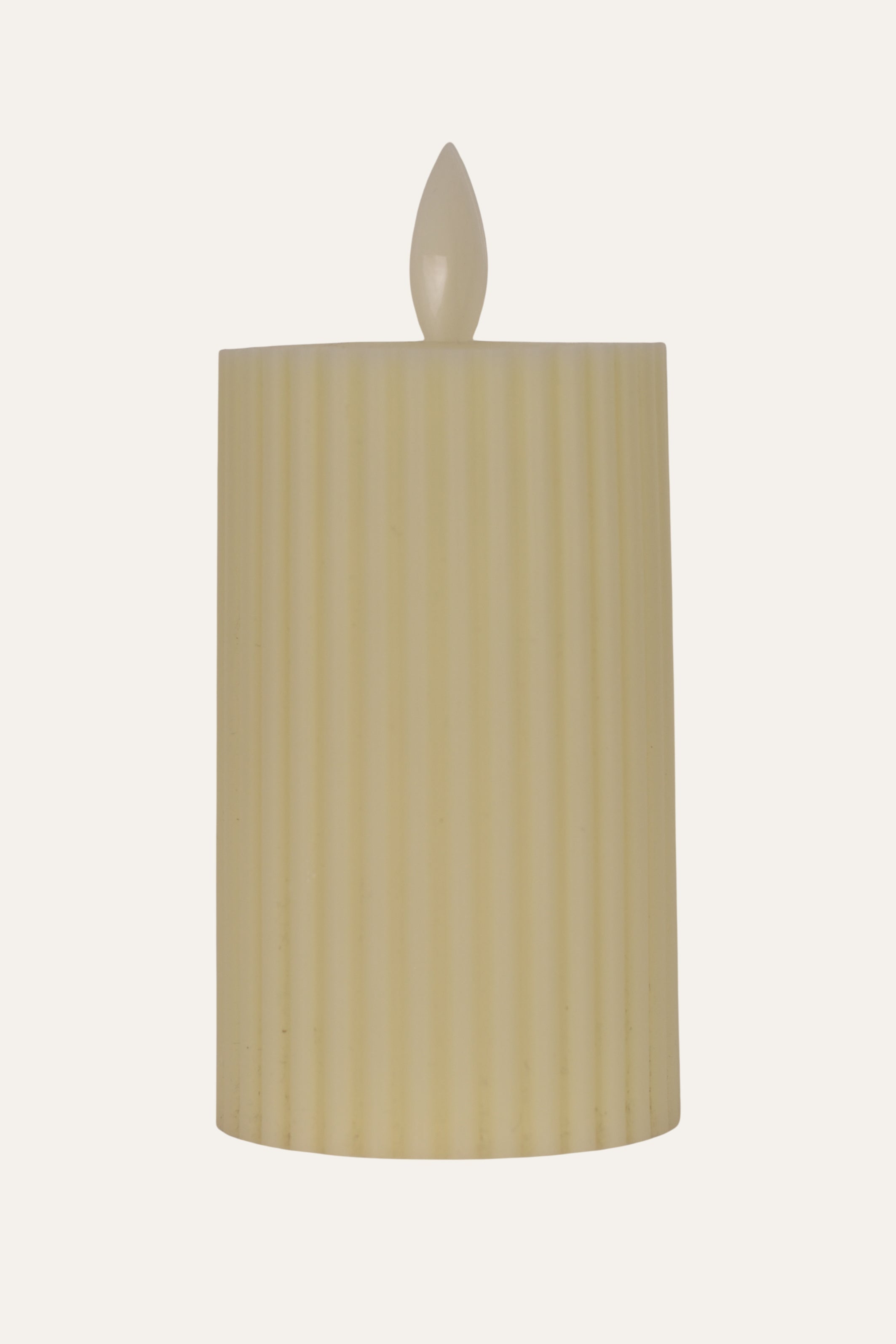 Beige candle with ribbed texture