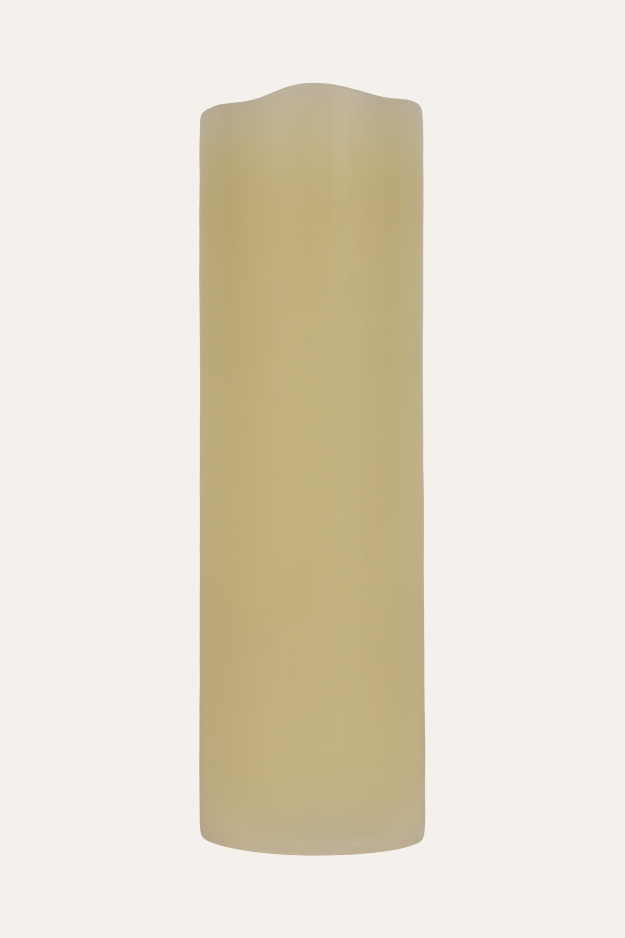 Beige cylindrical candle