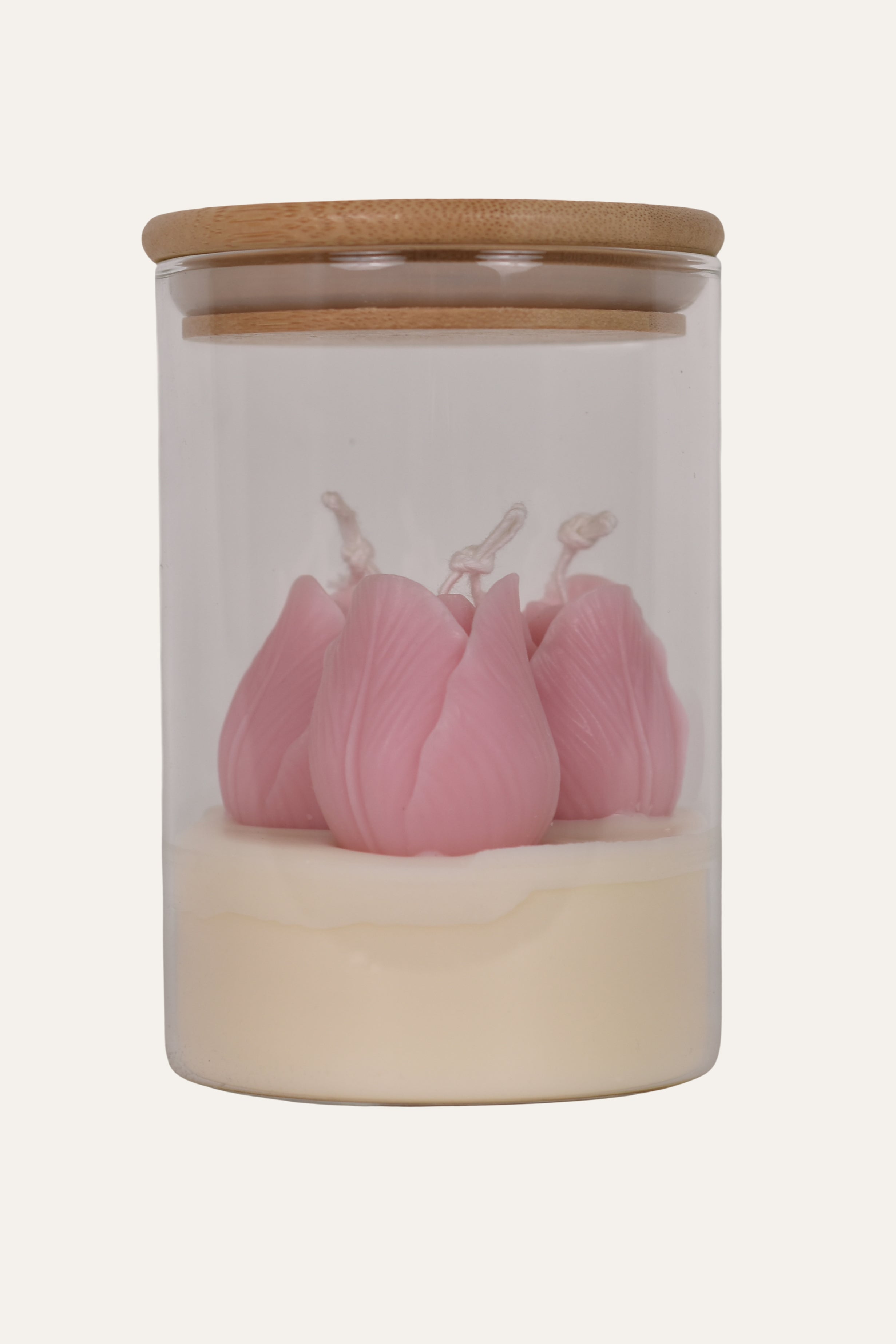 Jar with pink tulip-shaped candles