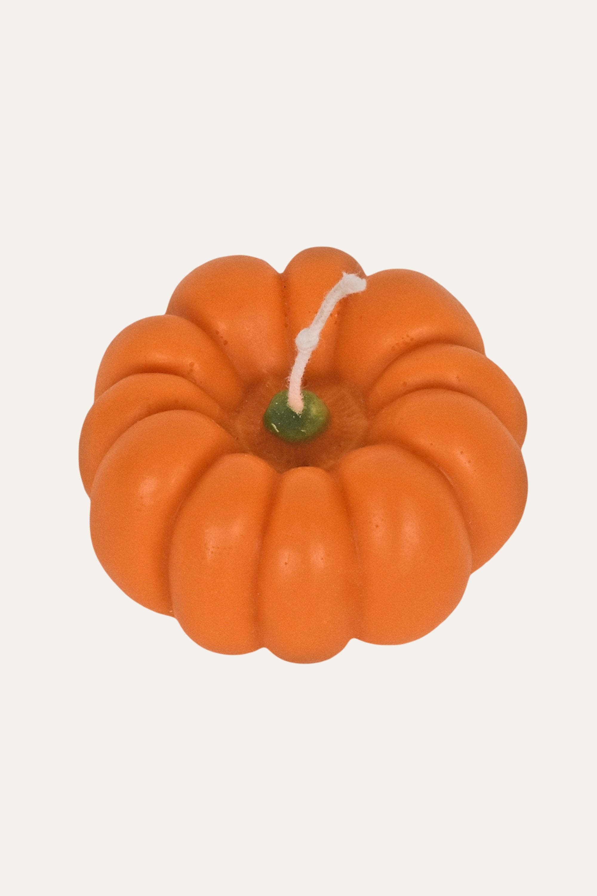 Pumpkin-shaped candle