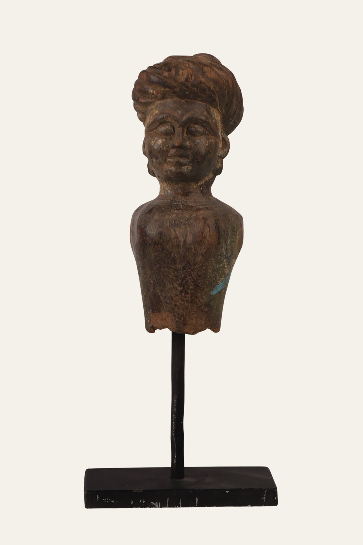 Carved wooden male bust on black stand