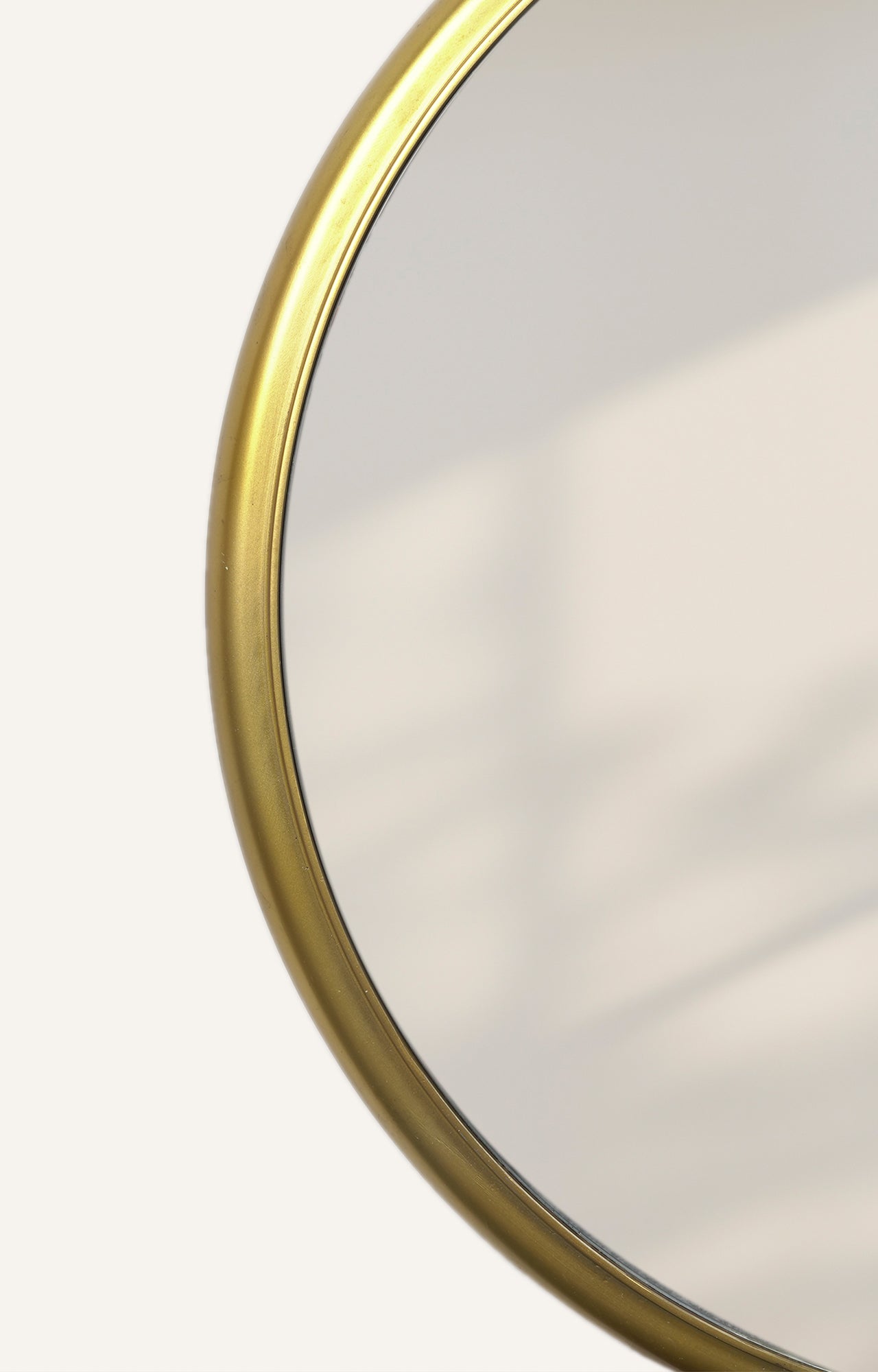 Gold finish metal round frame mirror