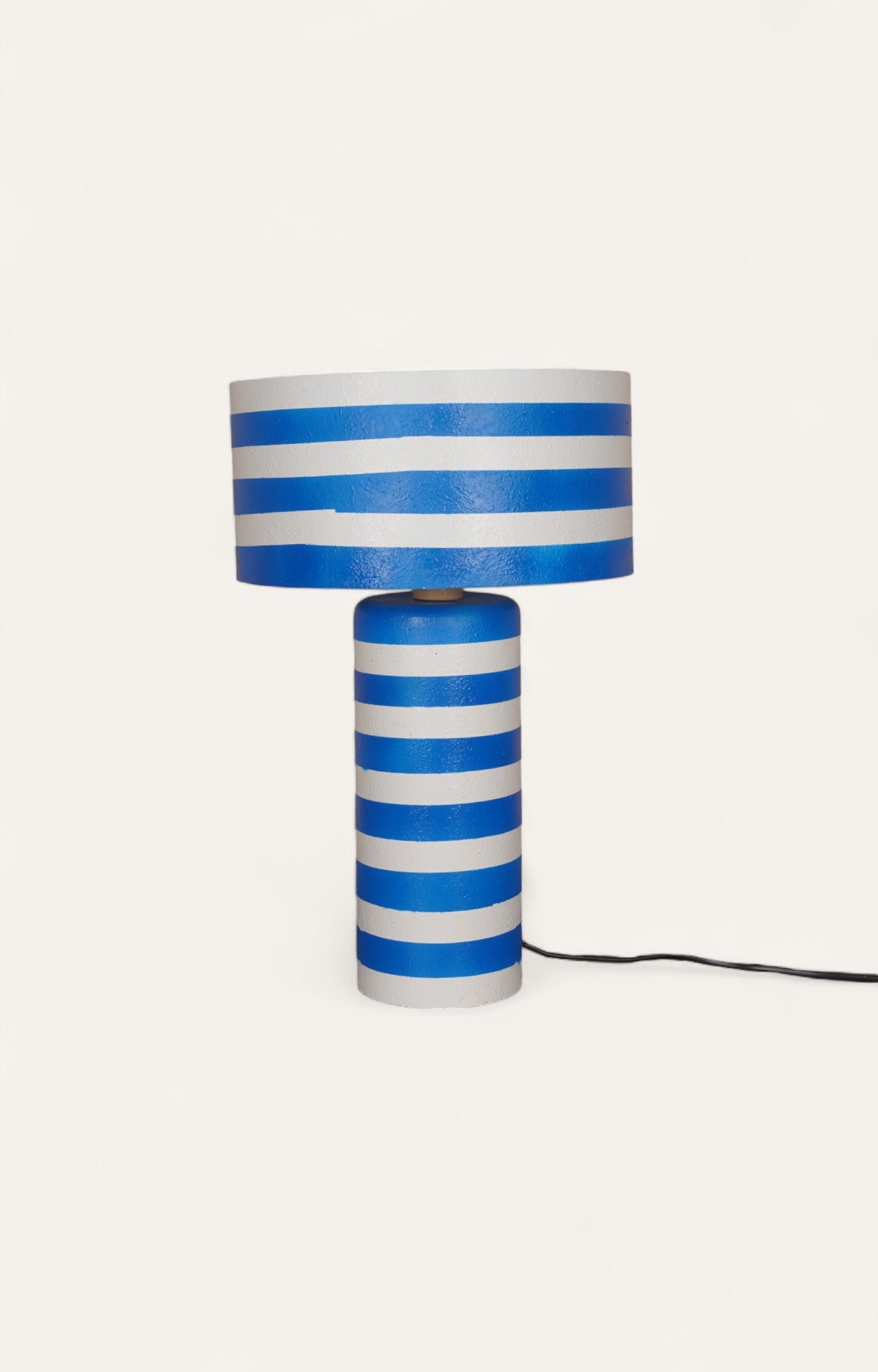Table lamp with hand-painted horizontal blue and white stripes on a Plaster of Paris base.
