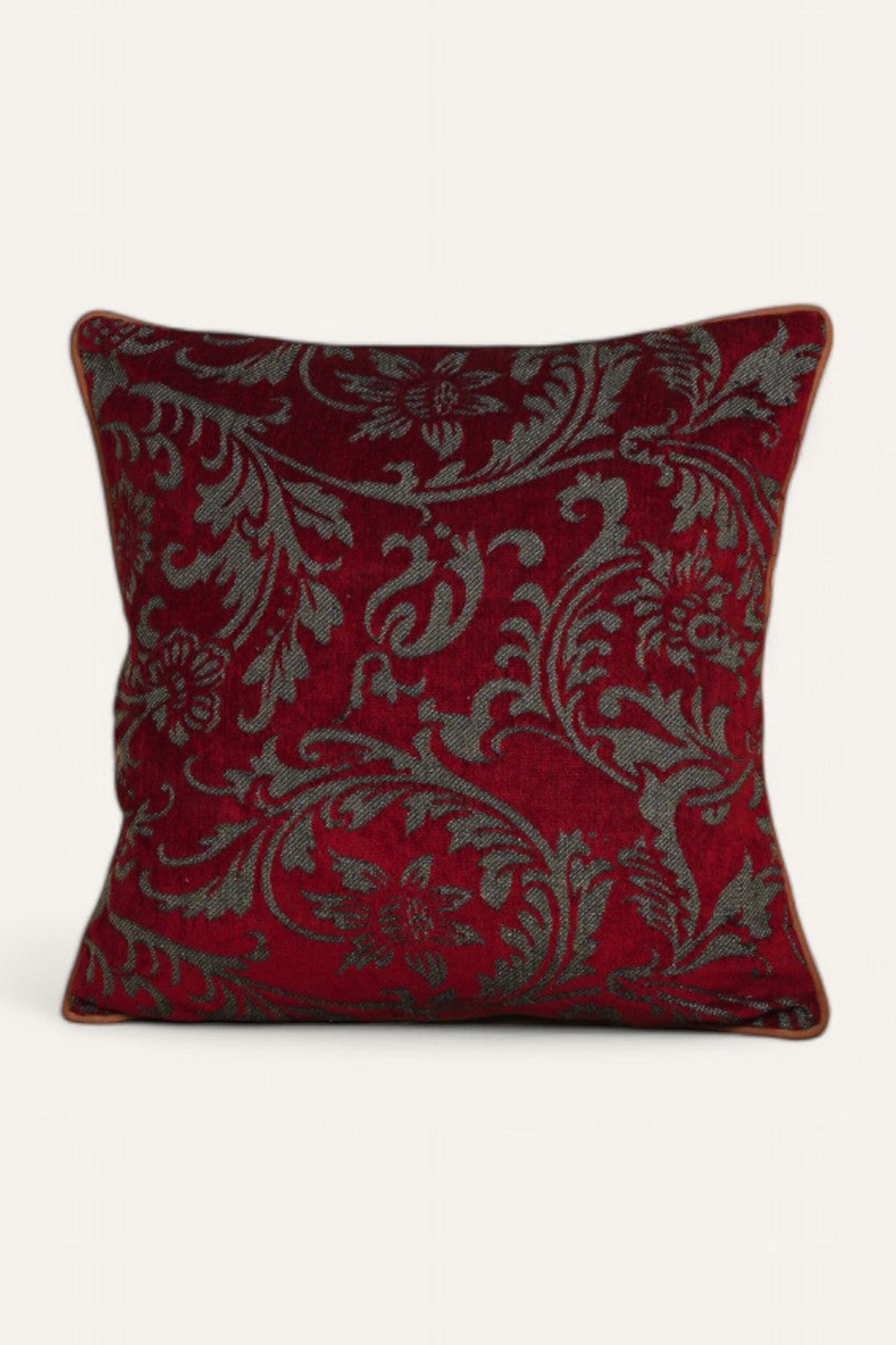 Red Cushion with Intricate Floral Pattern