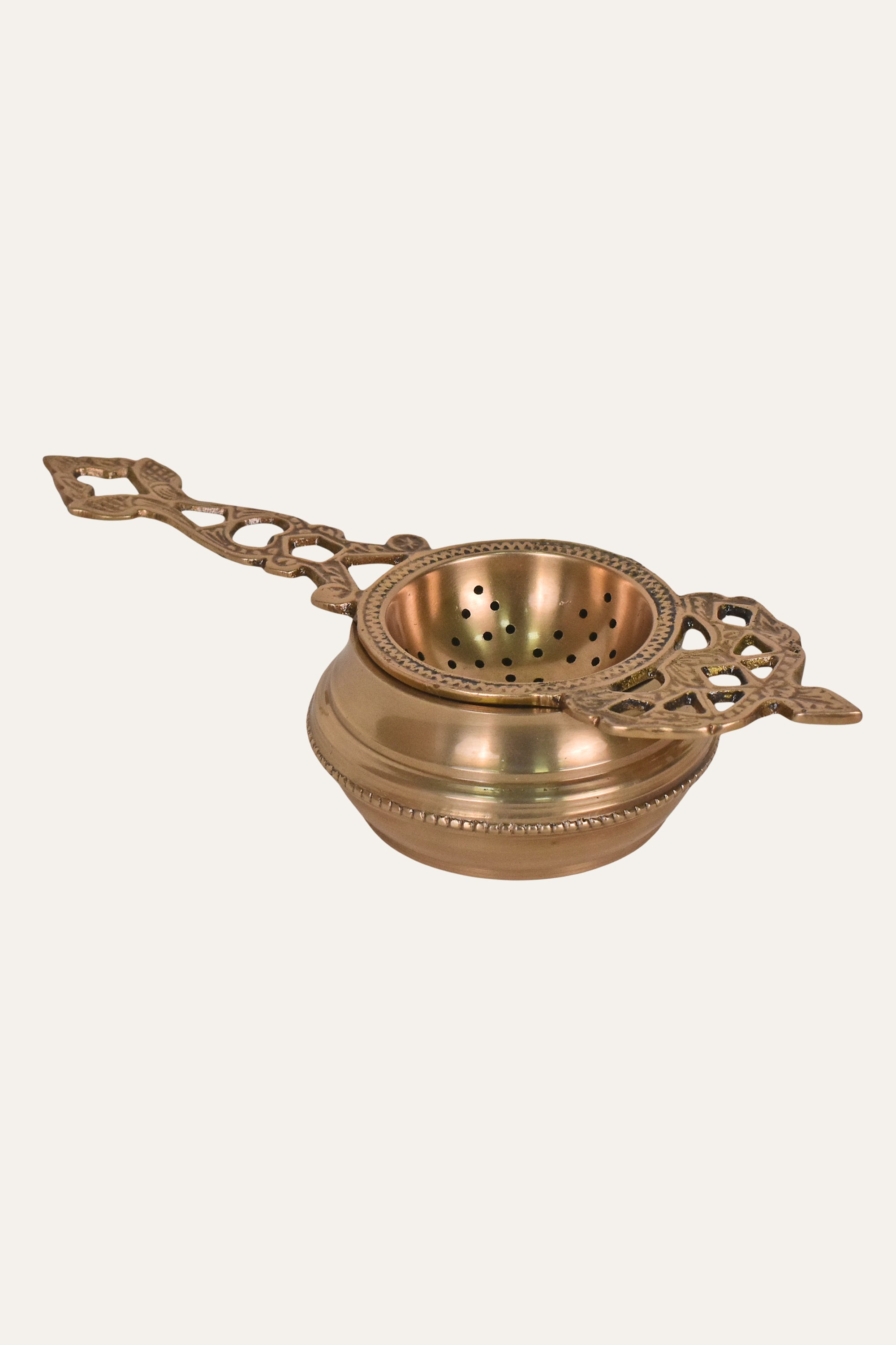 Handcrafted Antique Brass Tea Strainer with Decorative Handle & Perforated Bowl