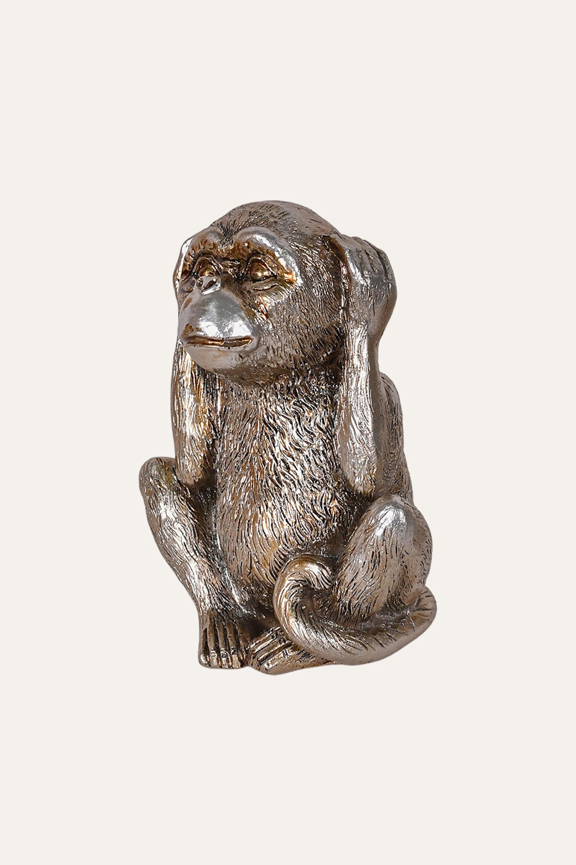 metallic silver monkey sculpture