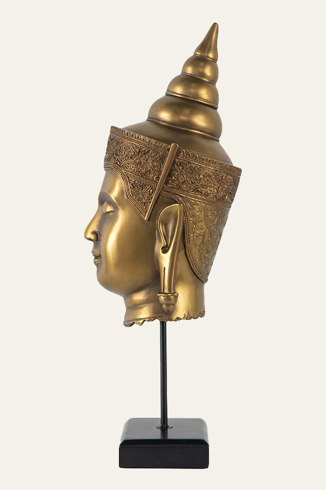 Gold Buddha head sculpture