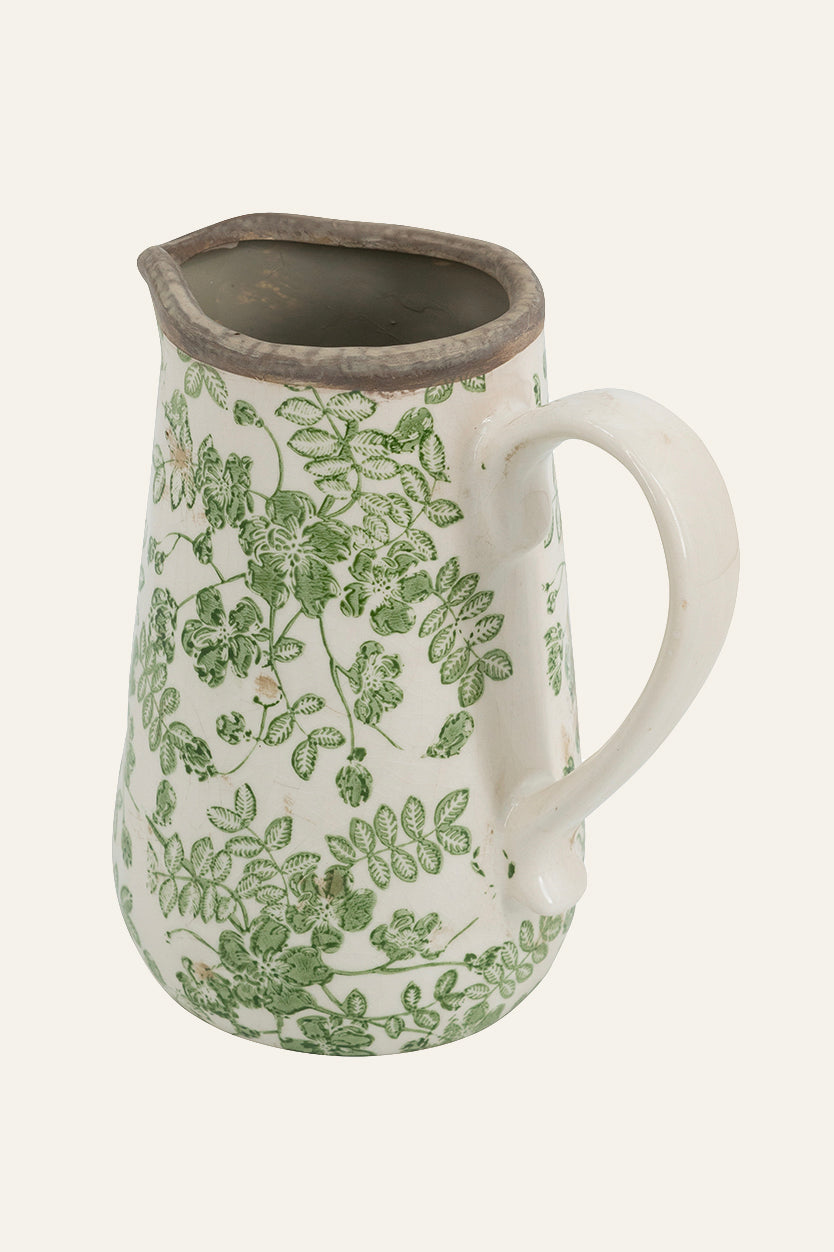 Ceramic pitcher with green floral pattern