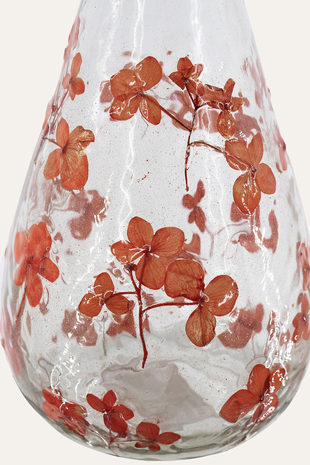 Glass vase with red floral 