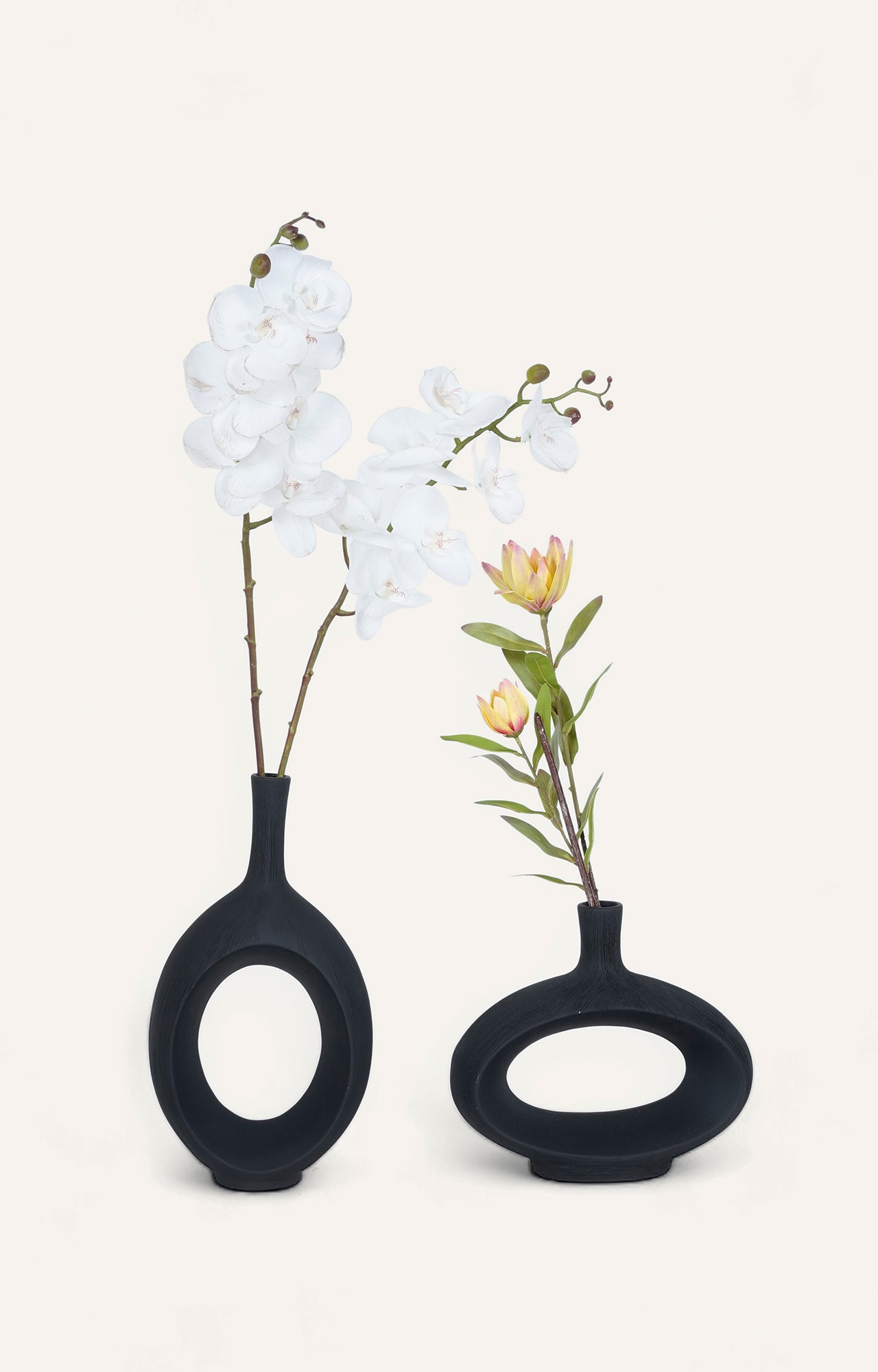 Pair of Modern Black Ceramic Vases with Oval Cutouts