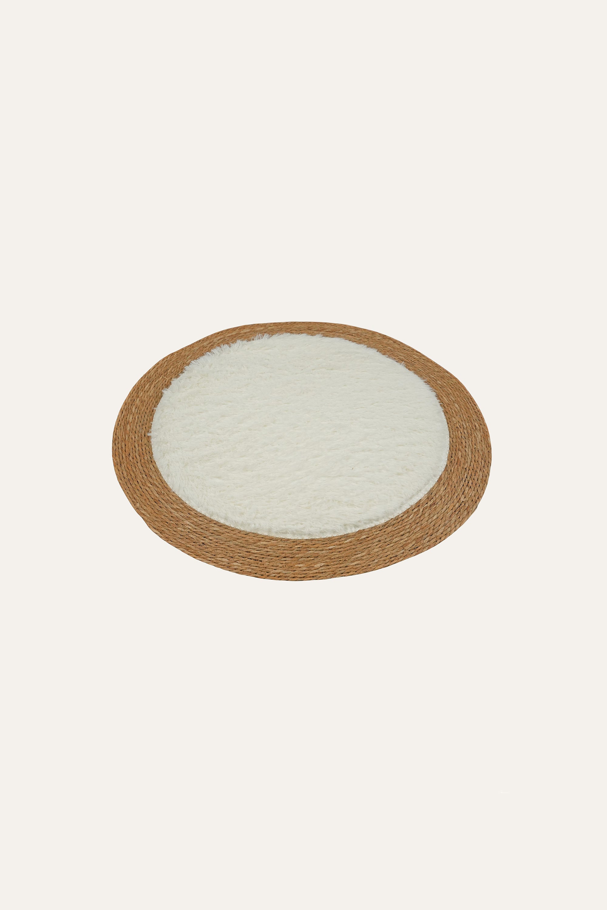 Handwoven round natural fiber floor mat with brown border