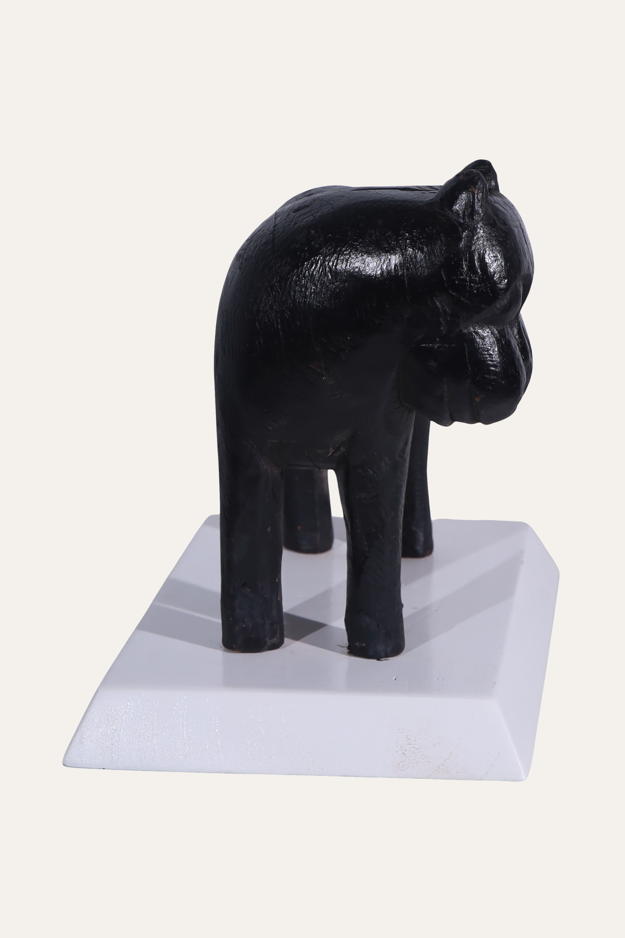 Black Animal Sculpture on White Display Base