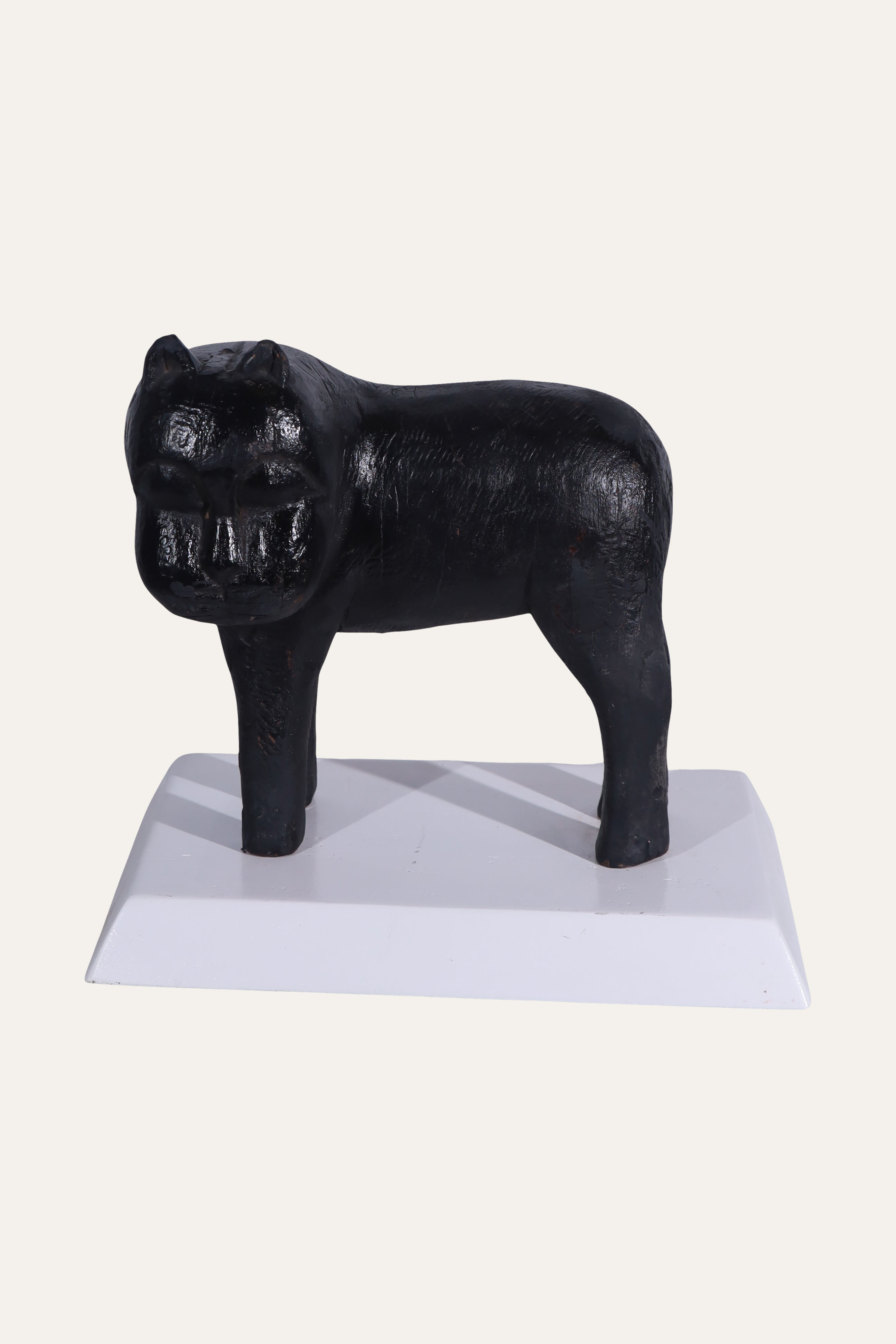 Black Animal Sculpture on White Display Base