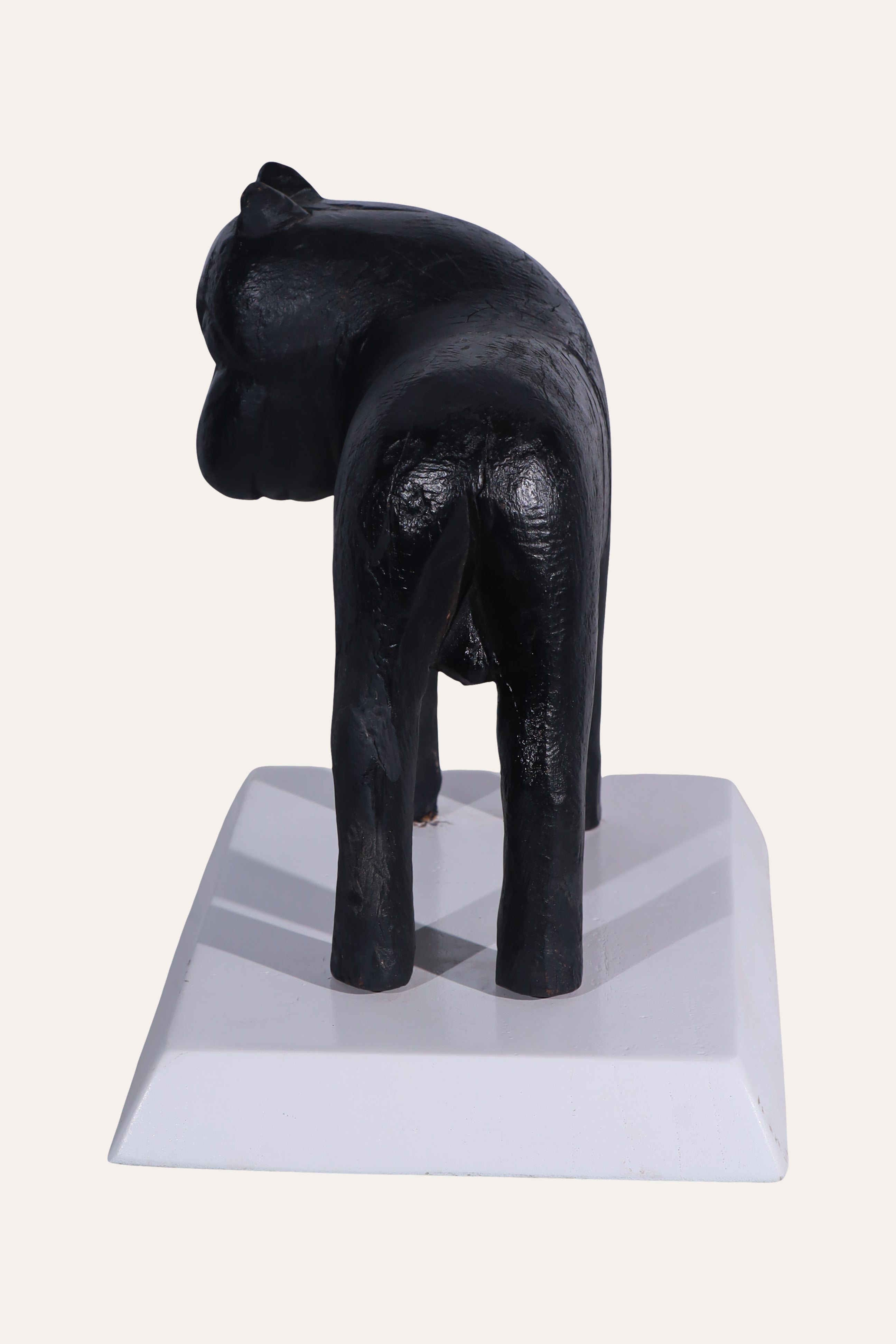 Black Animal Sculpture on White Display Base