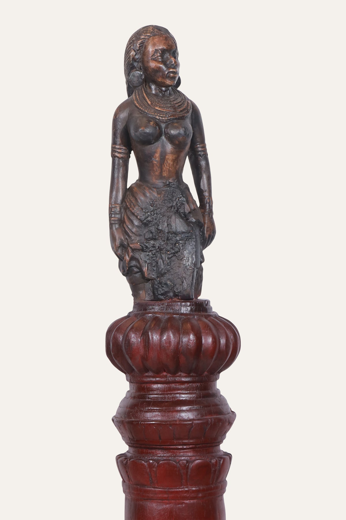 Sculpted Apsara Figurine on Decorative Pedestal Column