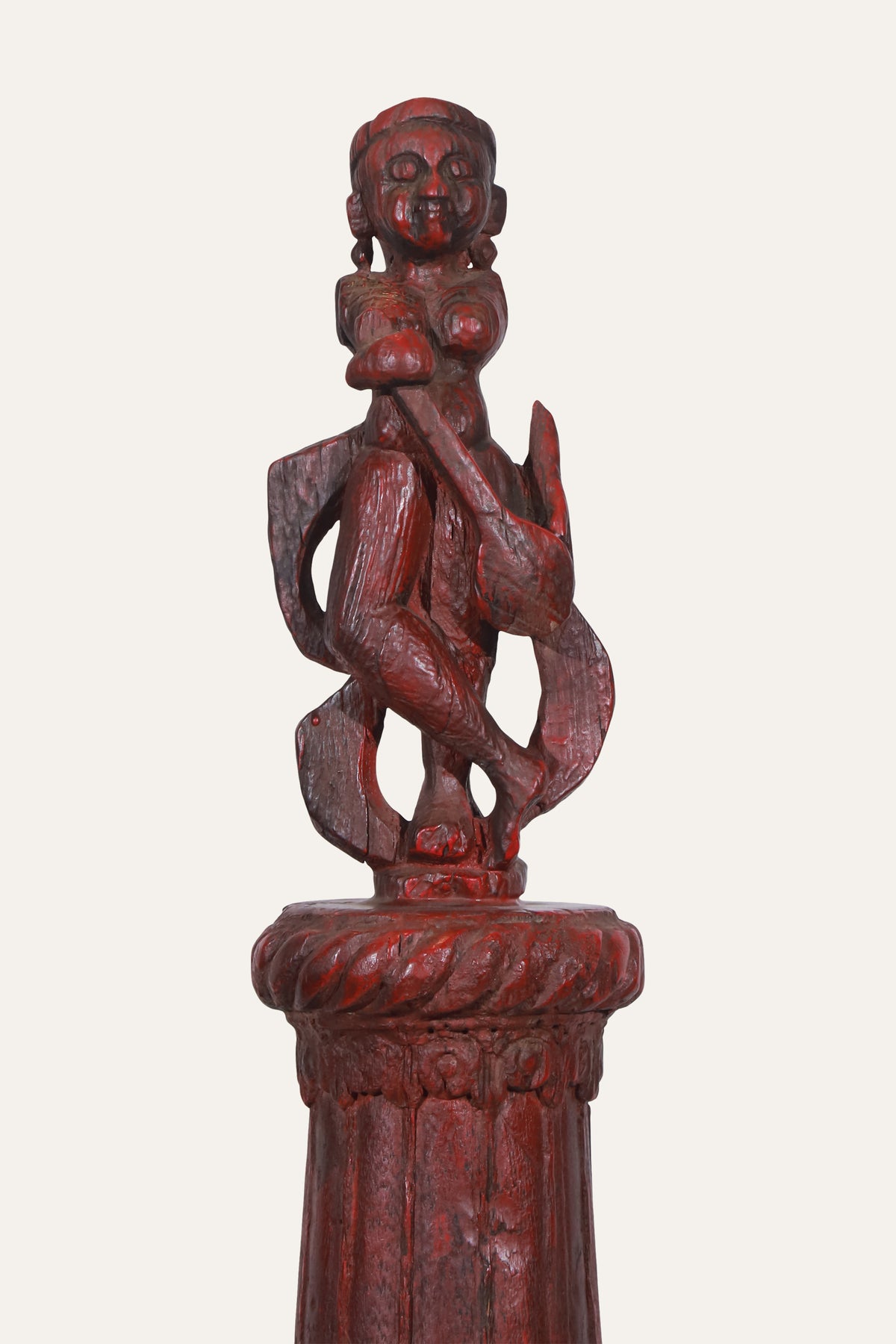 Carved Deity Figure on Red Terracotta Column