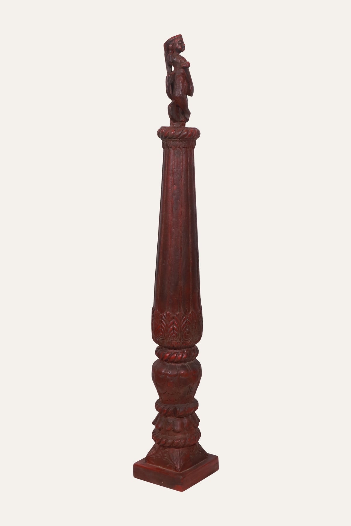 Carved Deity Figure on Red Terracotta Column