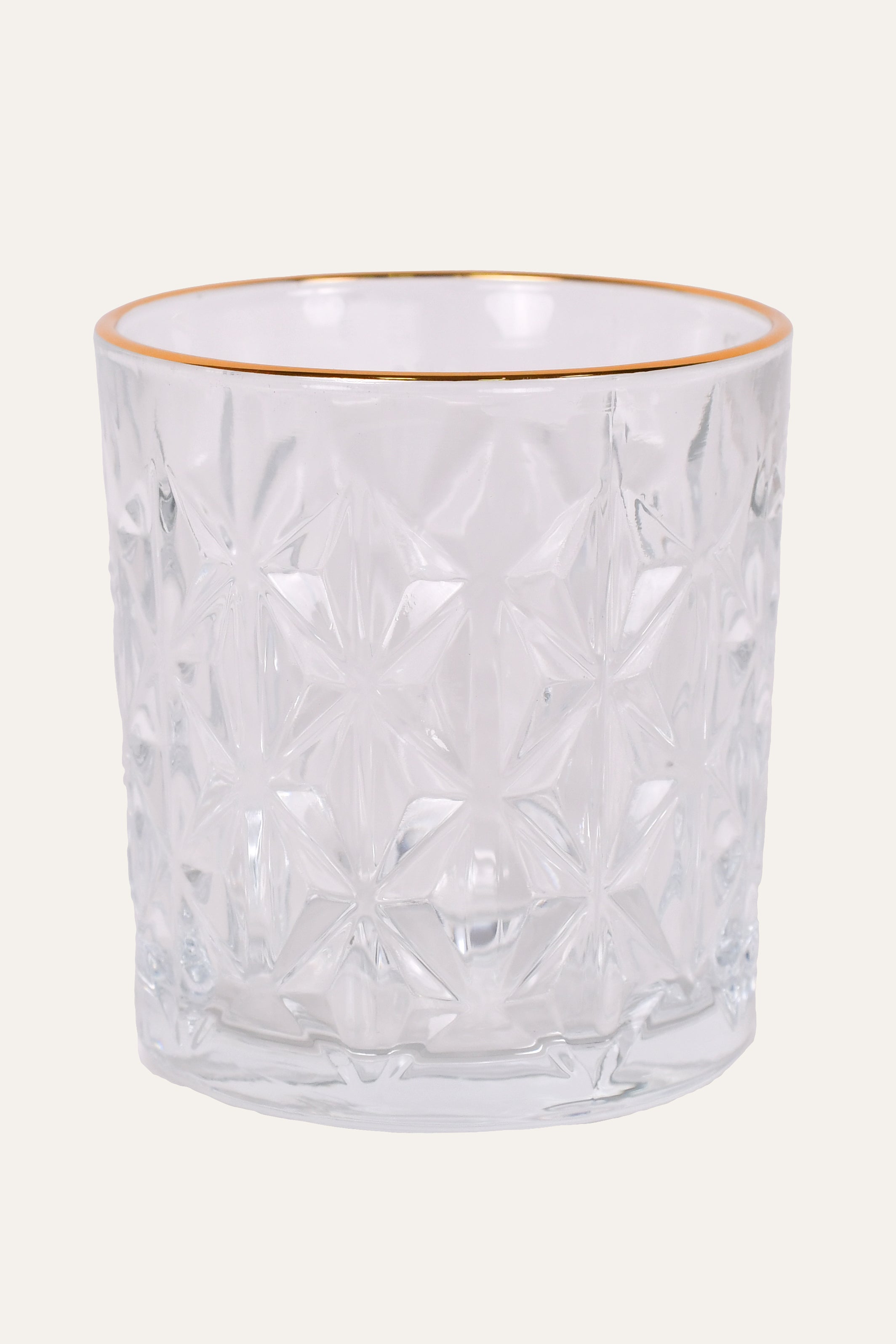 Luxury textured whisky glass with elegant gold rim