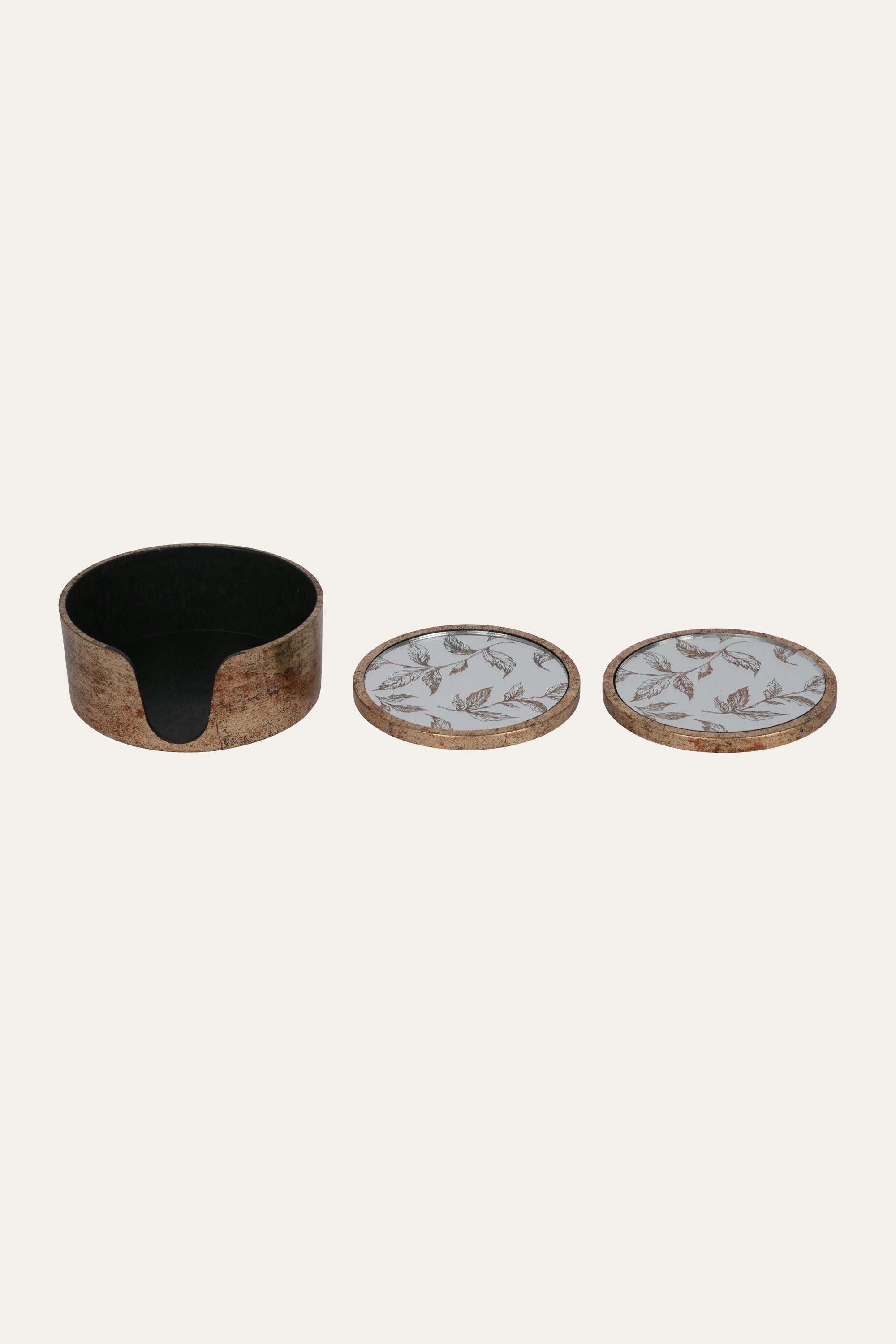 Mirrored glass coaster with decorative leaf pattern