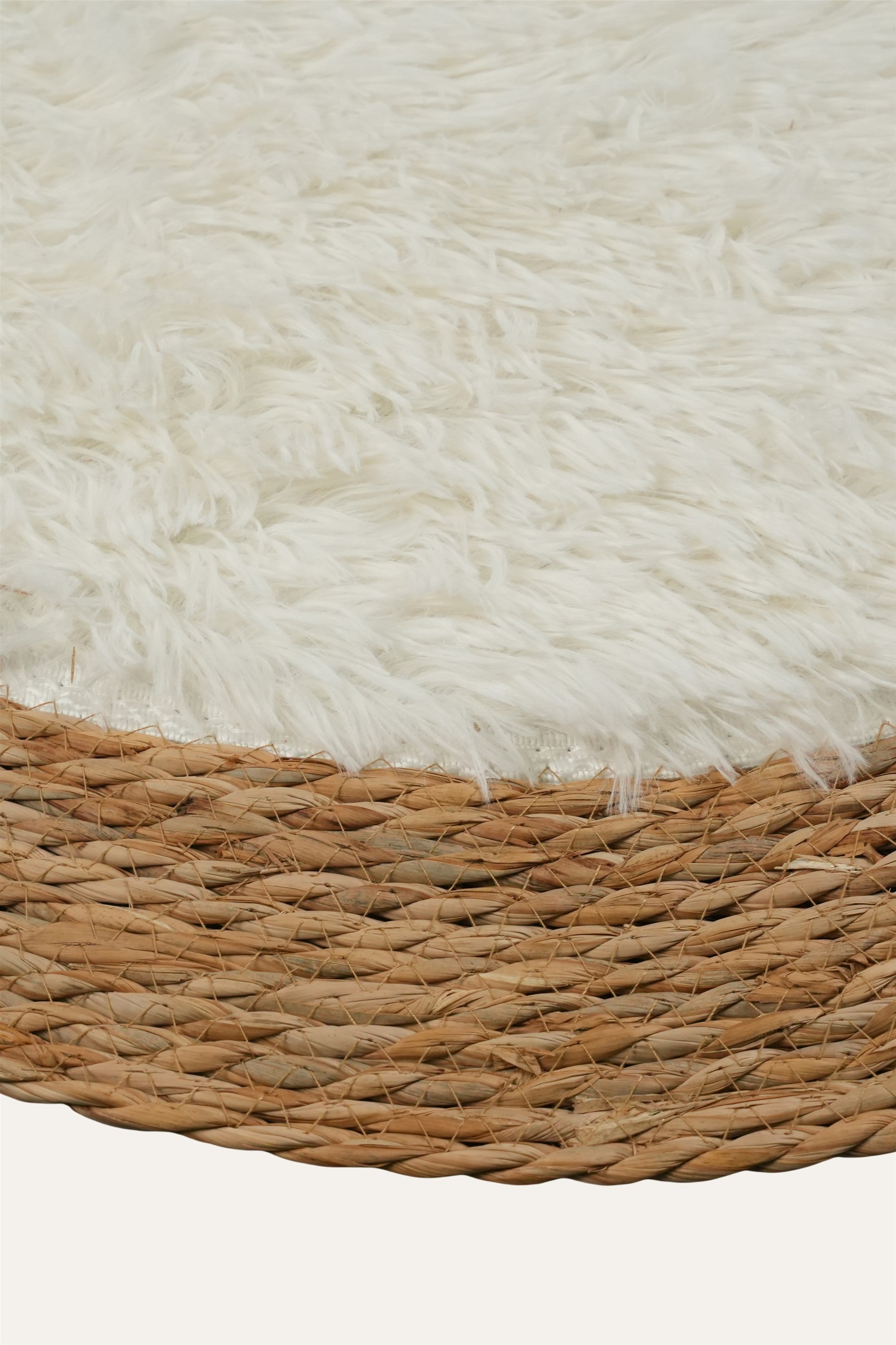 Oval woven rug with cream and brown border