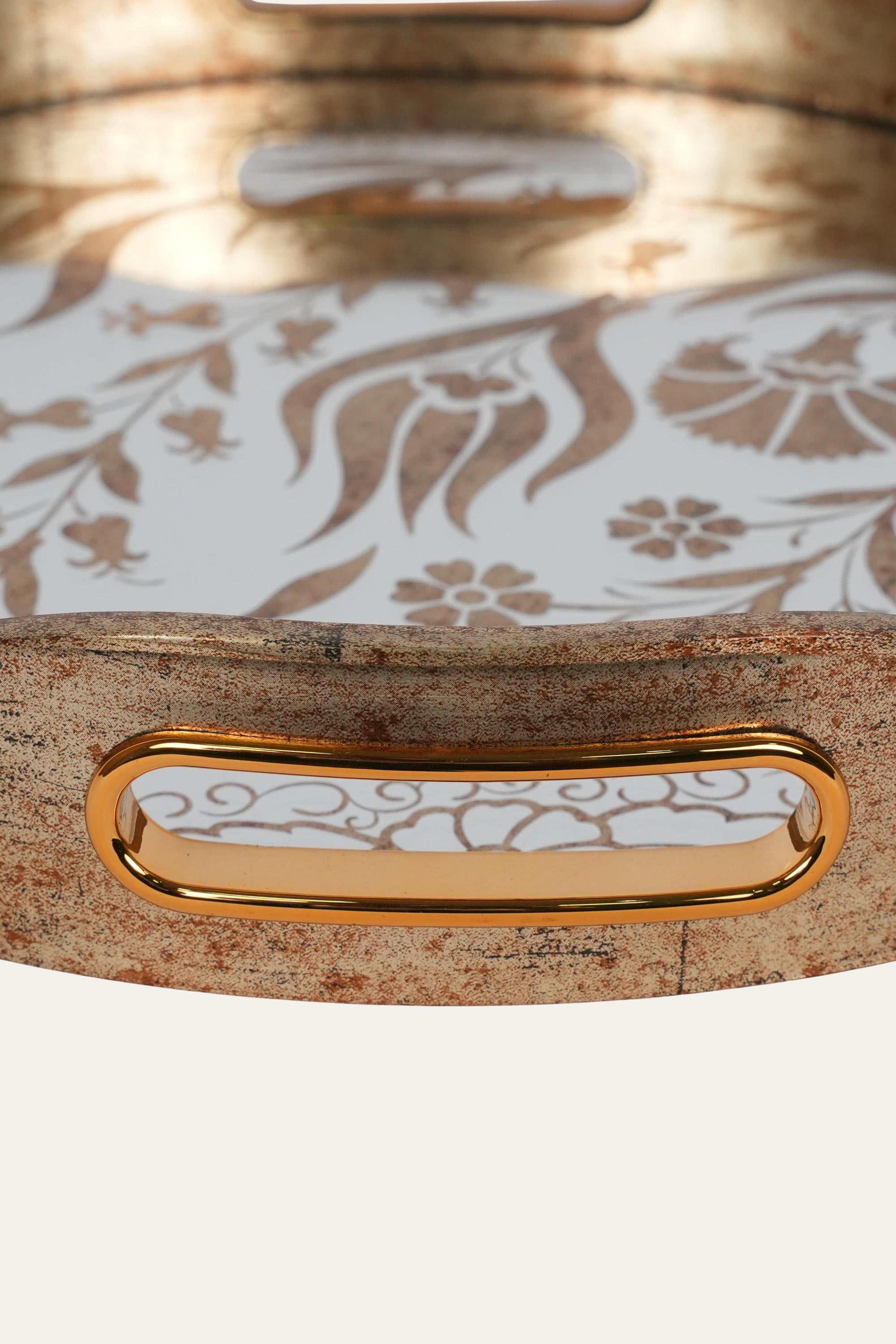 Round glass tray with elegant golden artwork