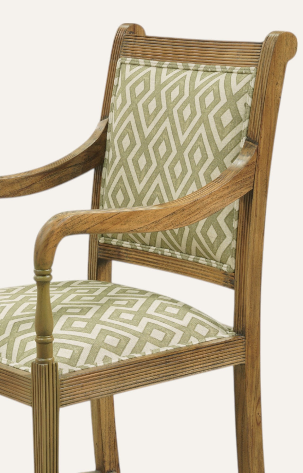 Wooden chair with patterned green cushion 