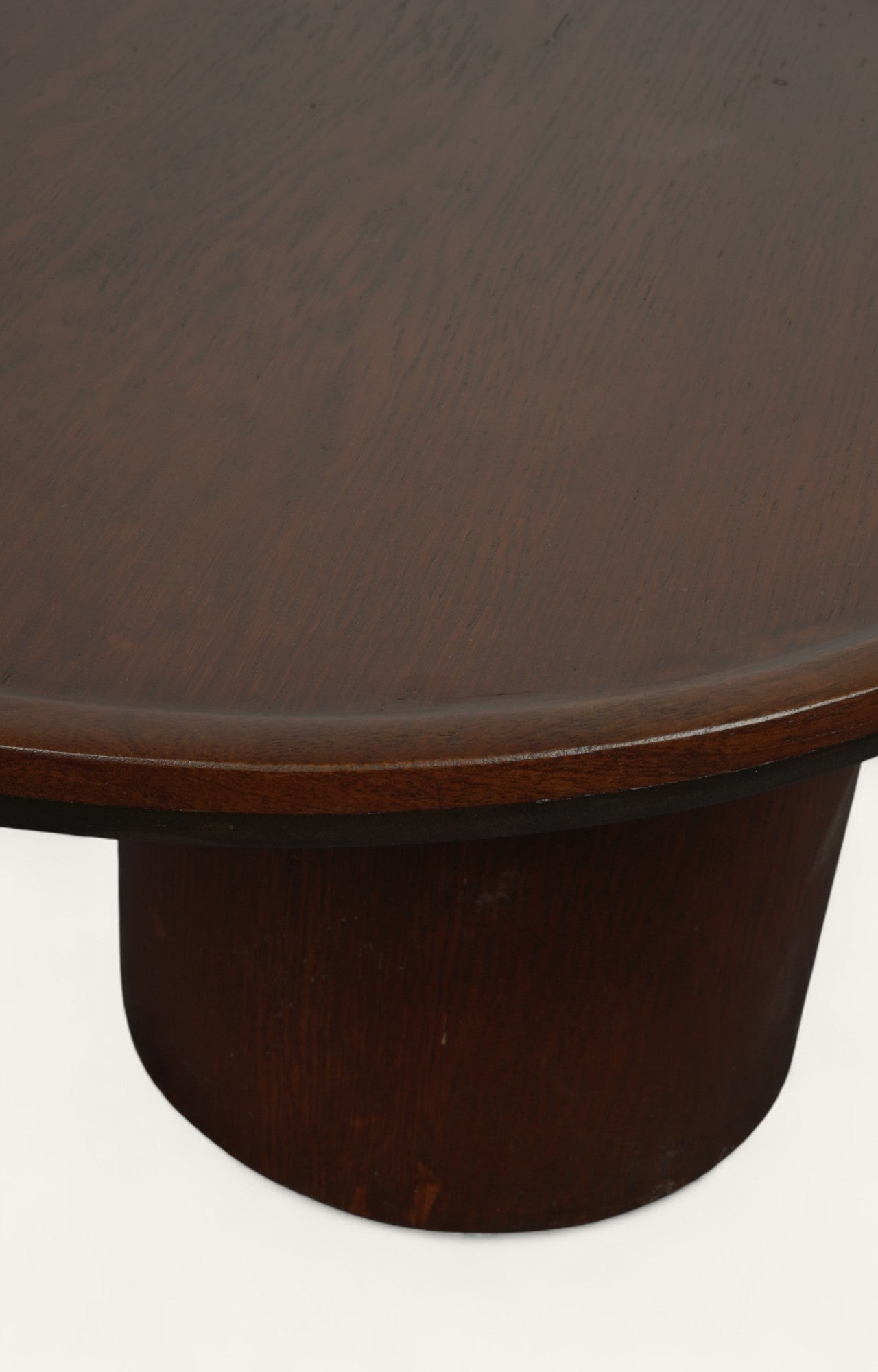 Wooden coffee table with a round top and cylindrical base 