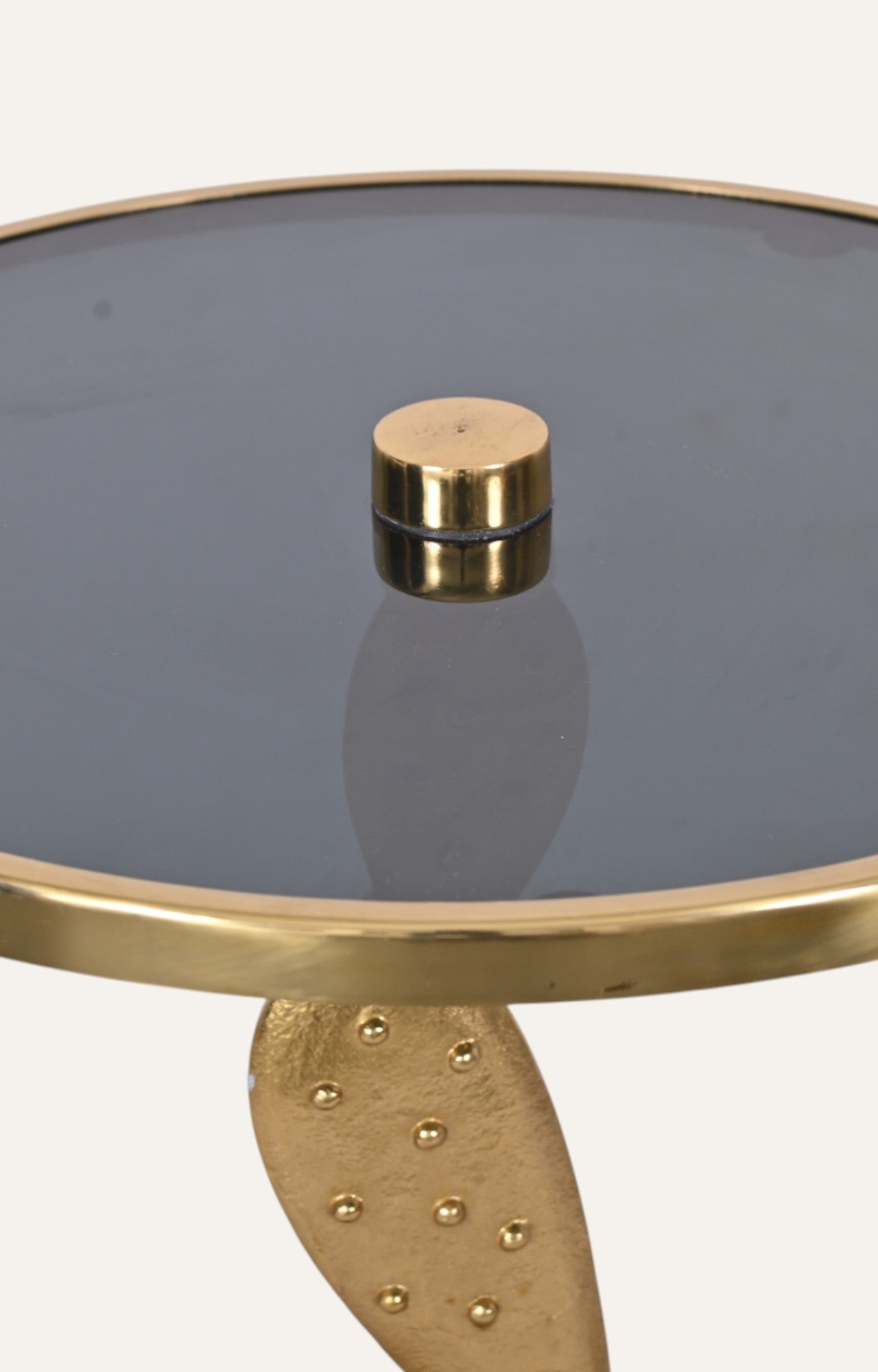Gold and glass side table with a unique design 