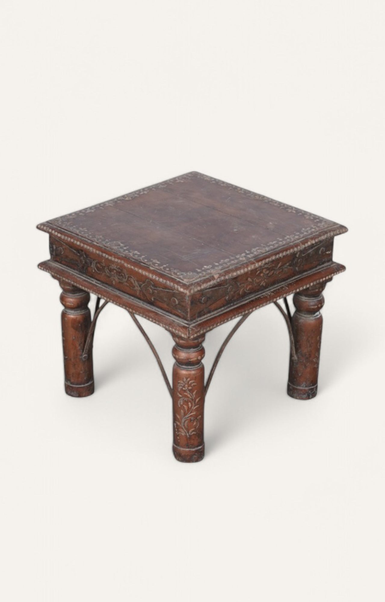 Wooden side table with intricate carvings