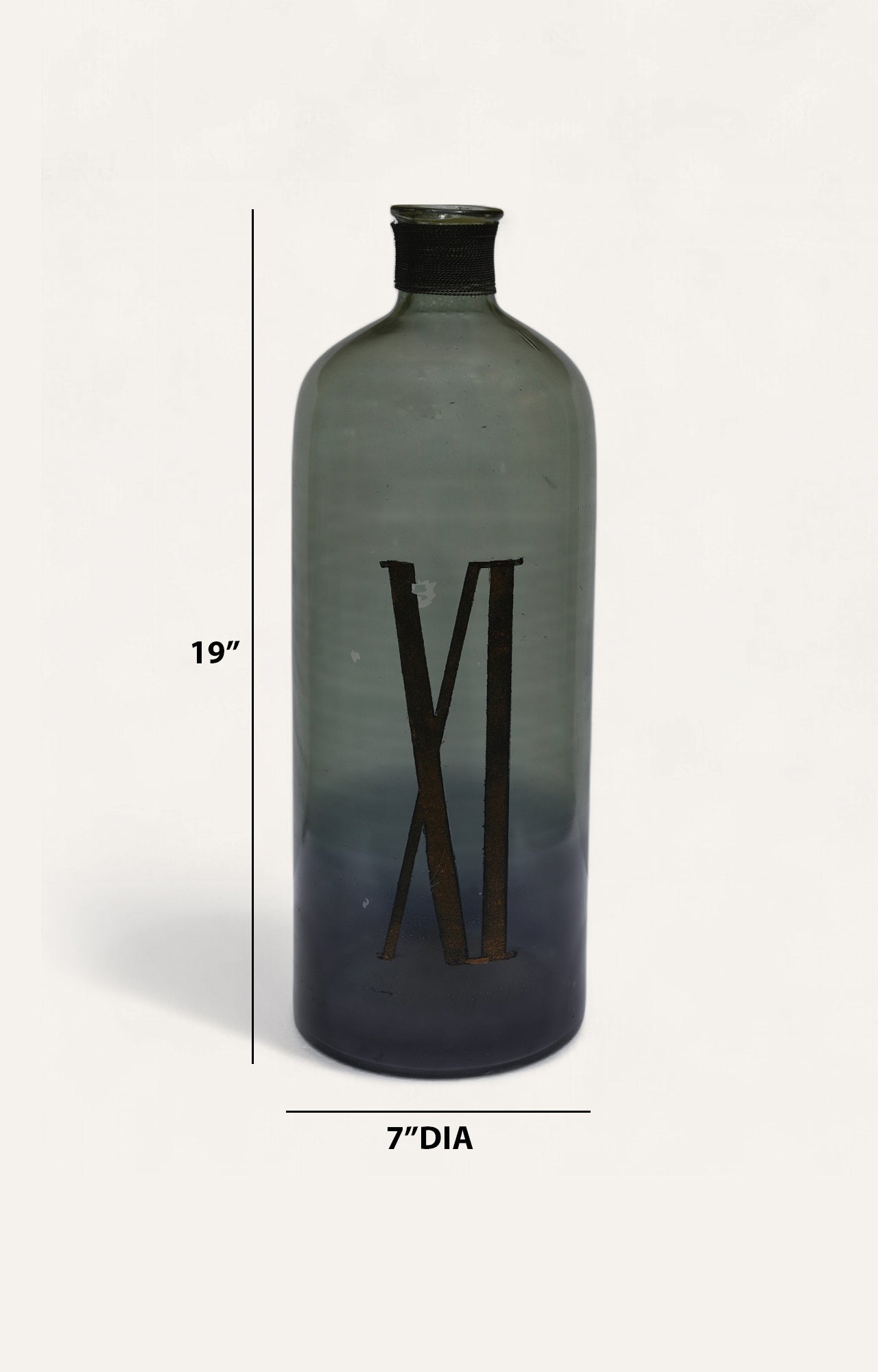 cylindrical bottle with 'XI' marking