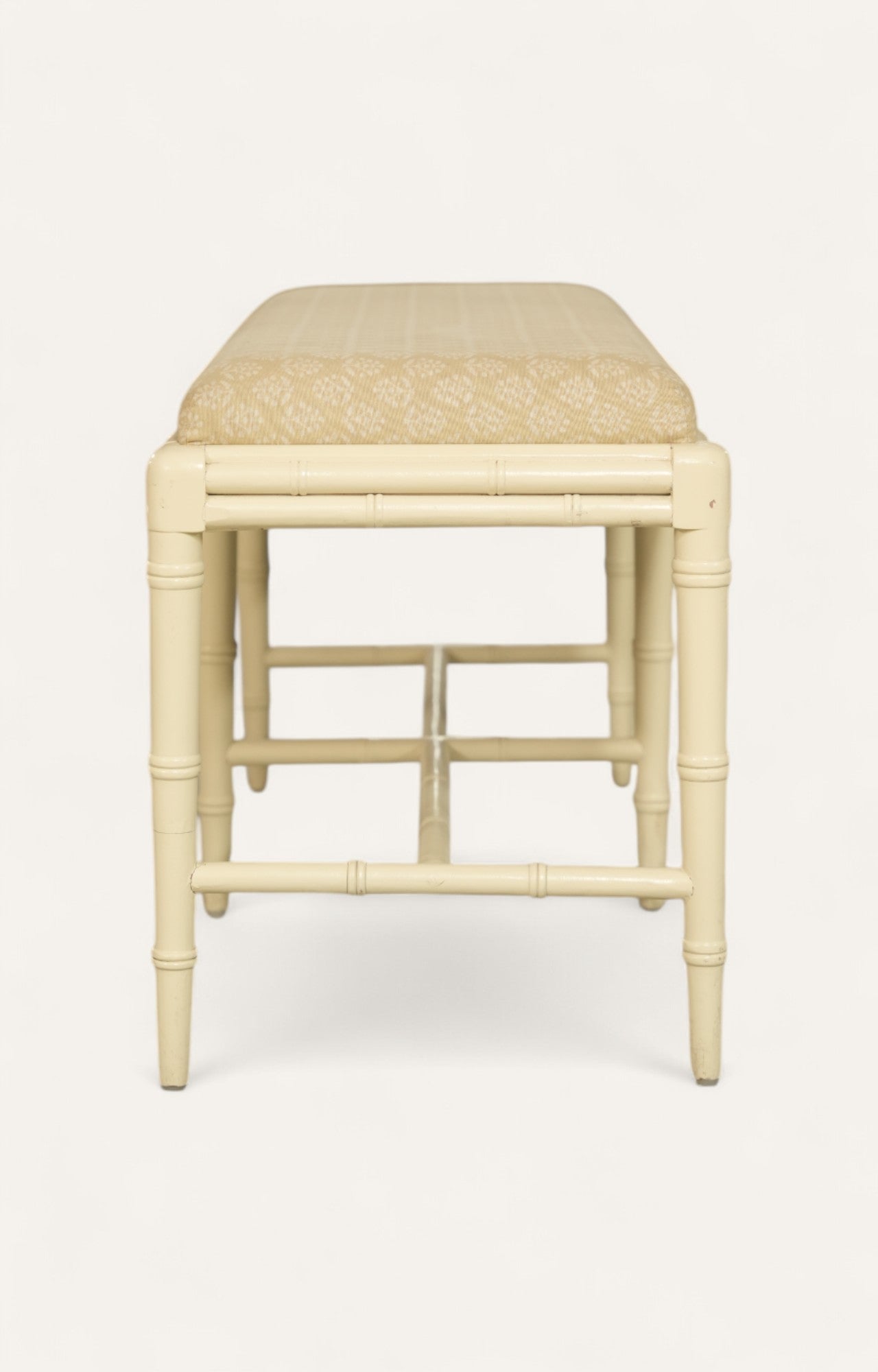 cream-painted bench