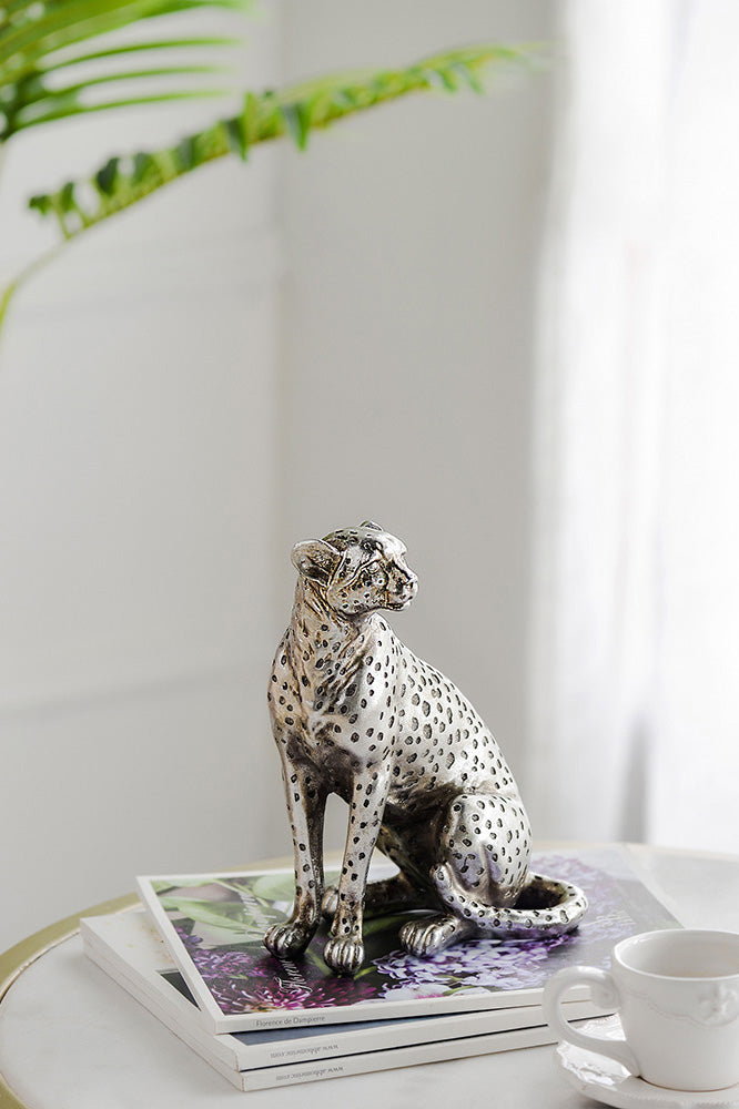 Sitting silver leopard figurine