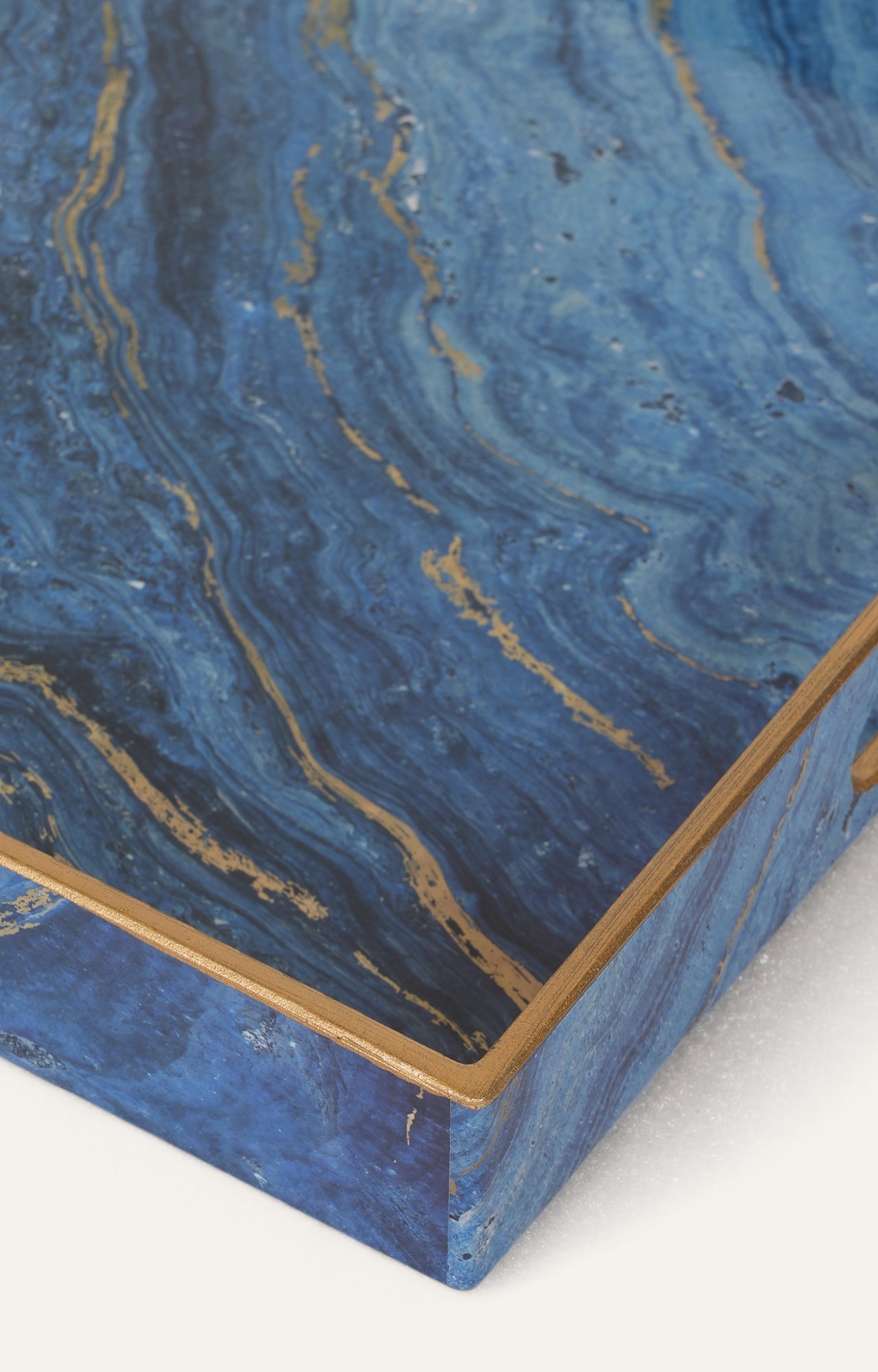 Tray ﬁnished with gold trim