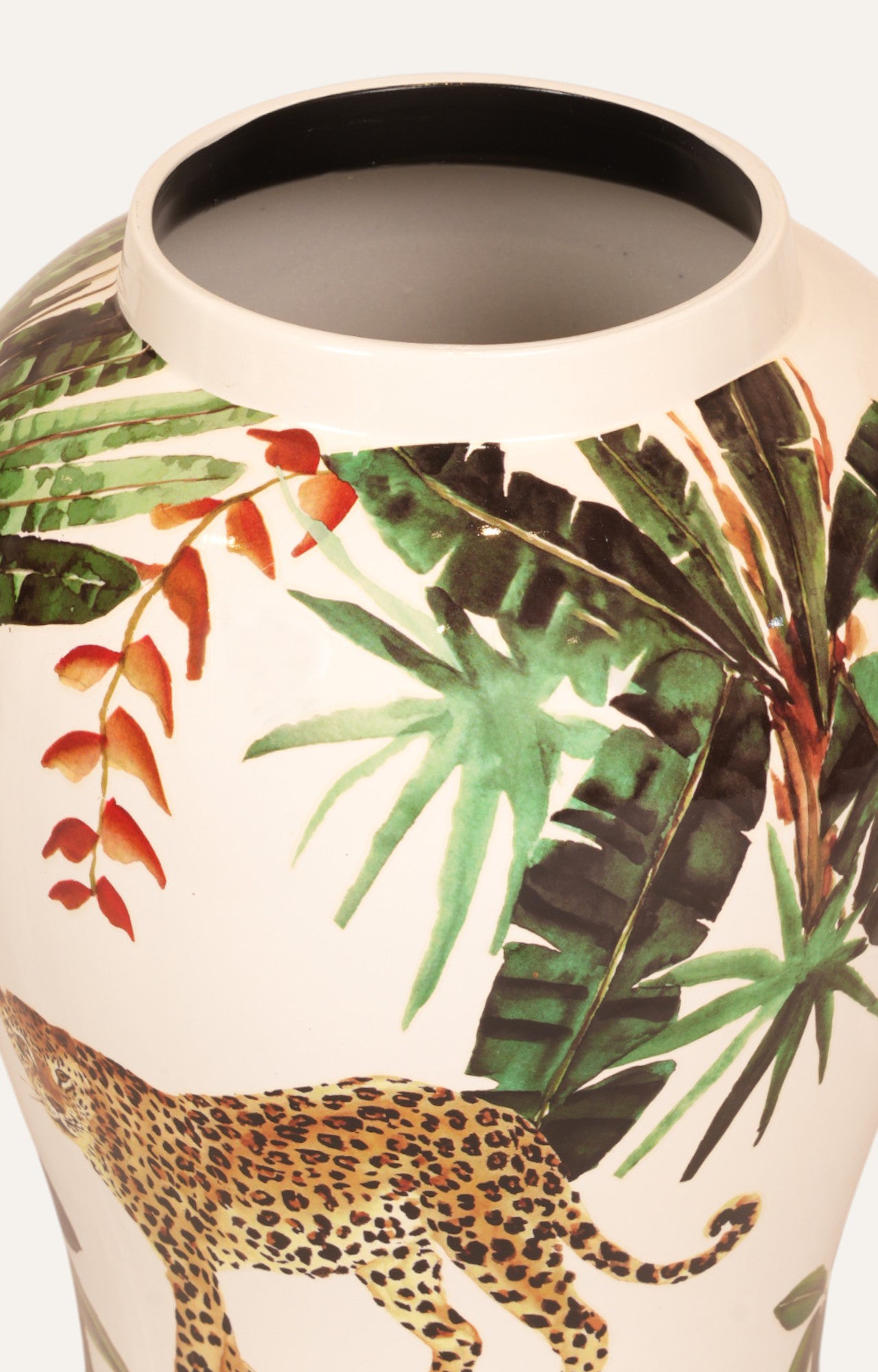 Vase with tropical leaf