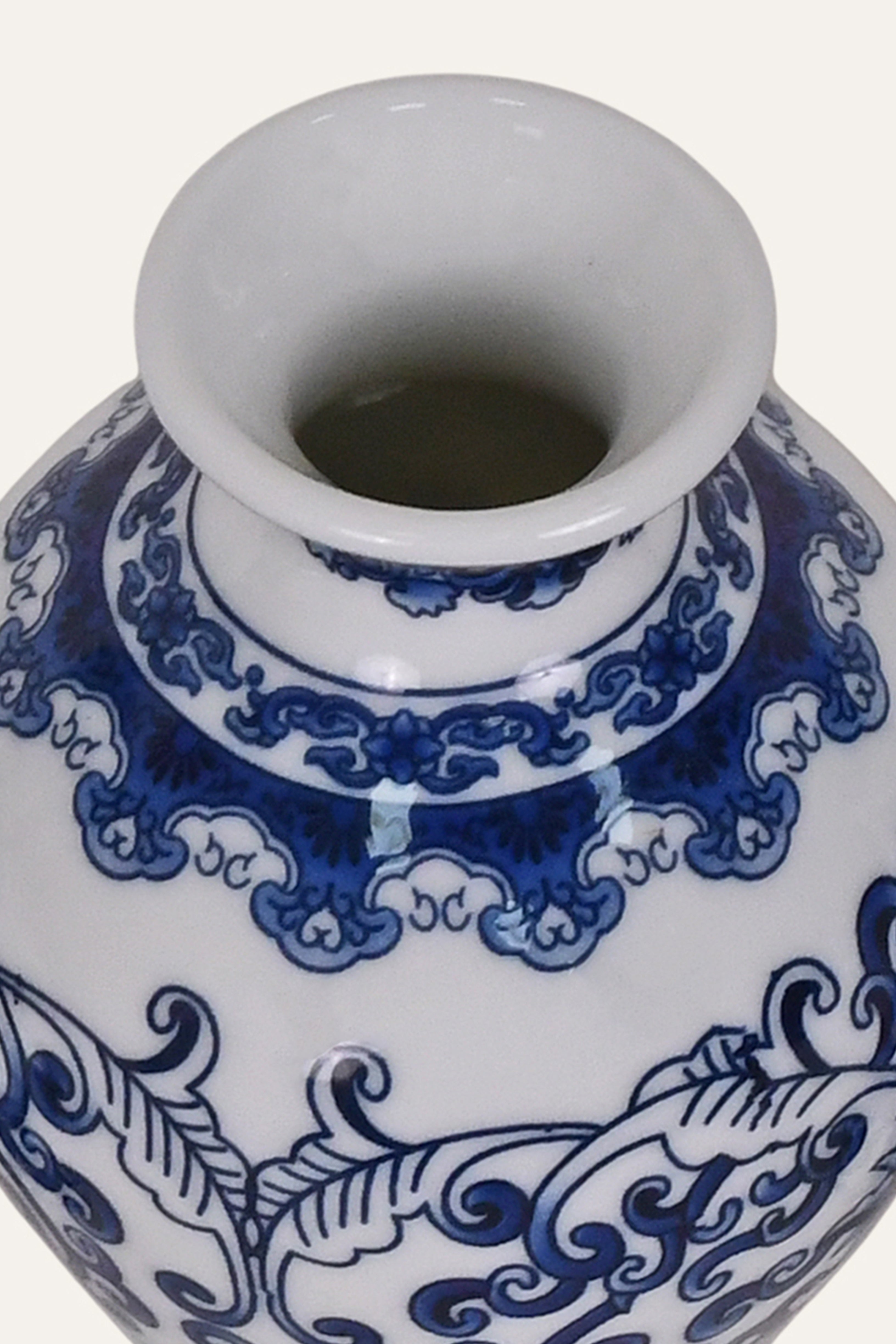Ceramic vase with blue and white decorative patterns