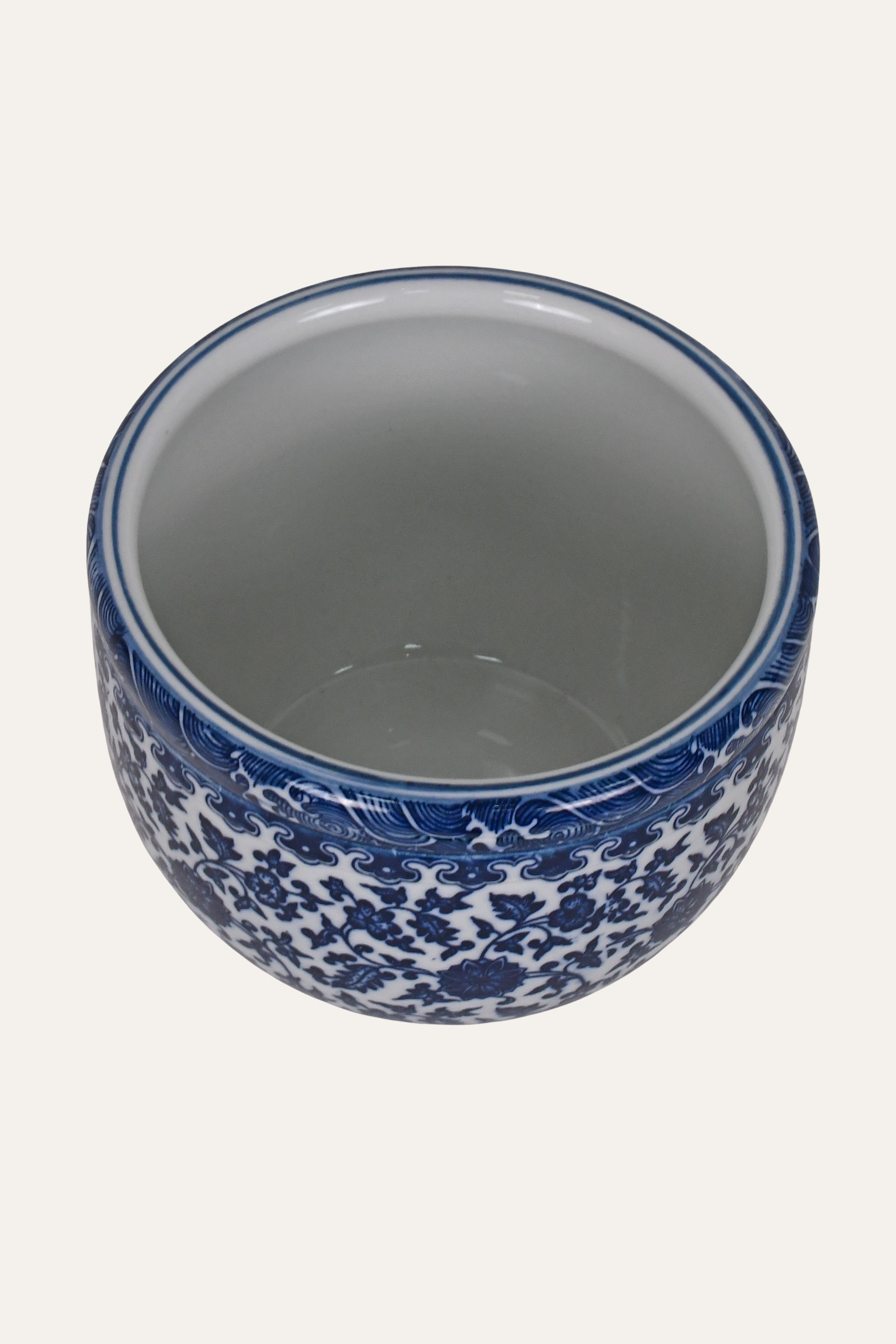 Ceramic cup with blue floral pattern