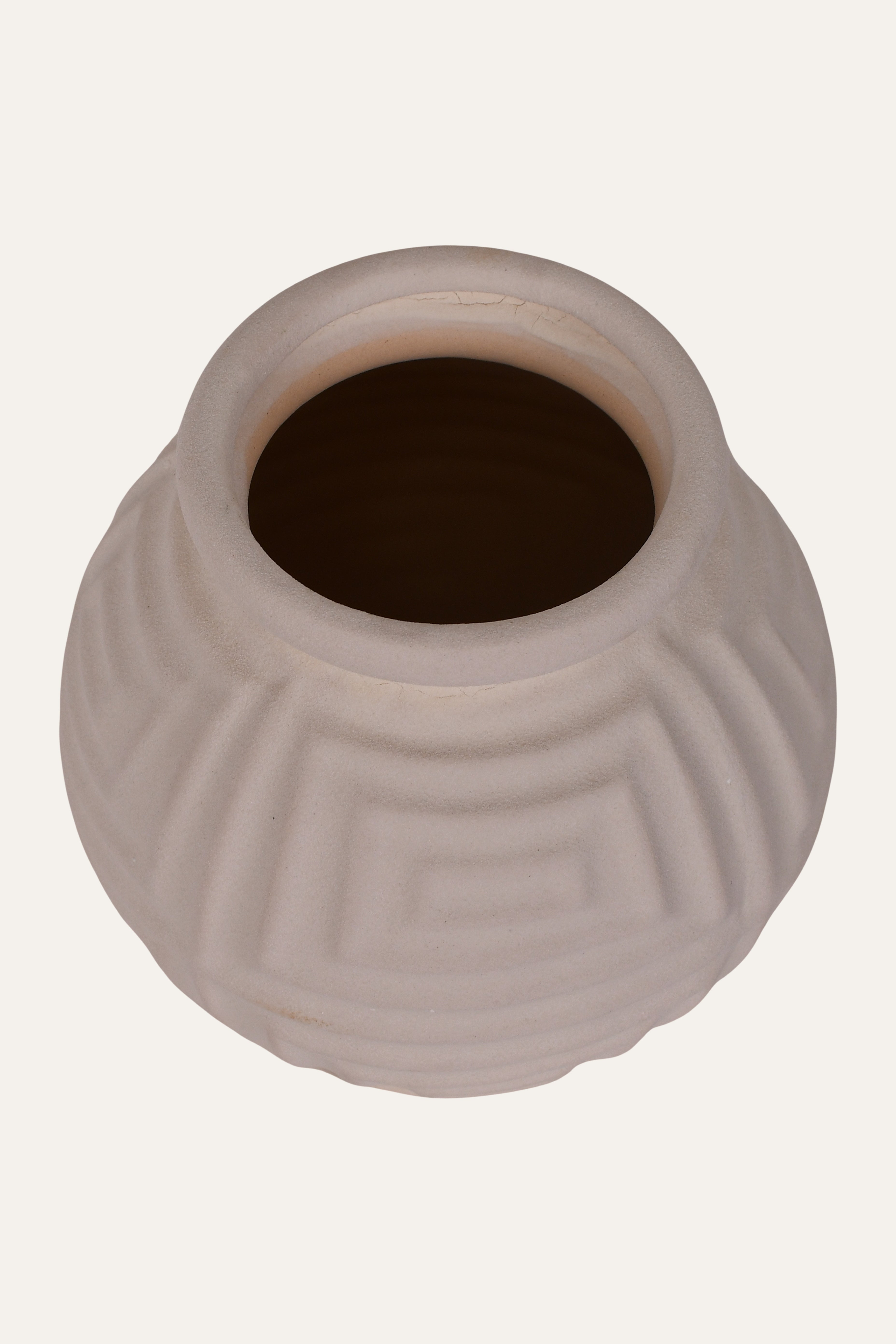 Beige ceramic vase with textured surface