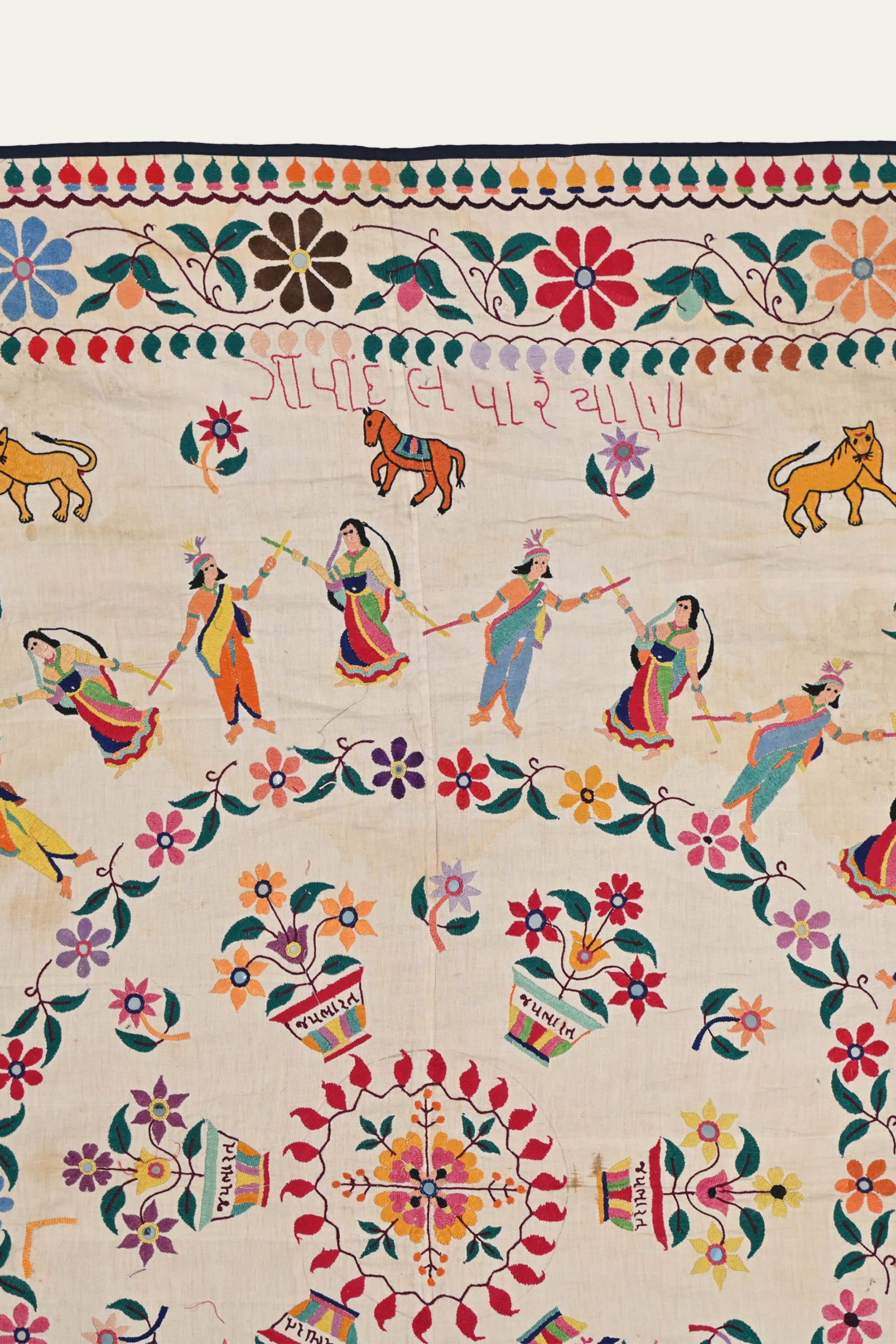 Vintage Indian textile wall art with embroidery
