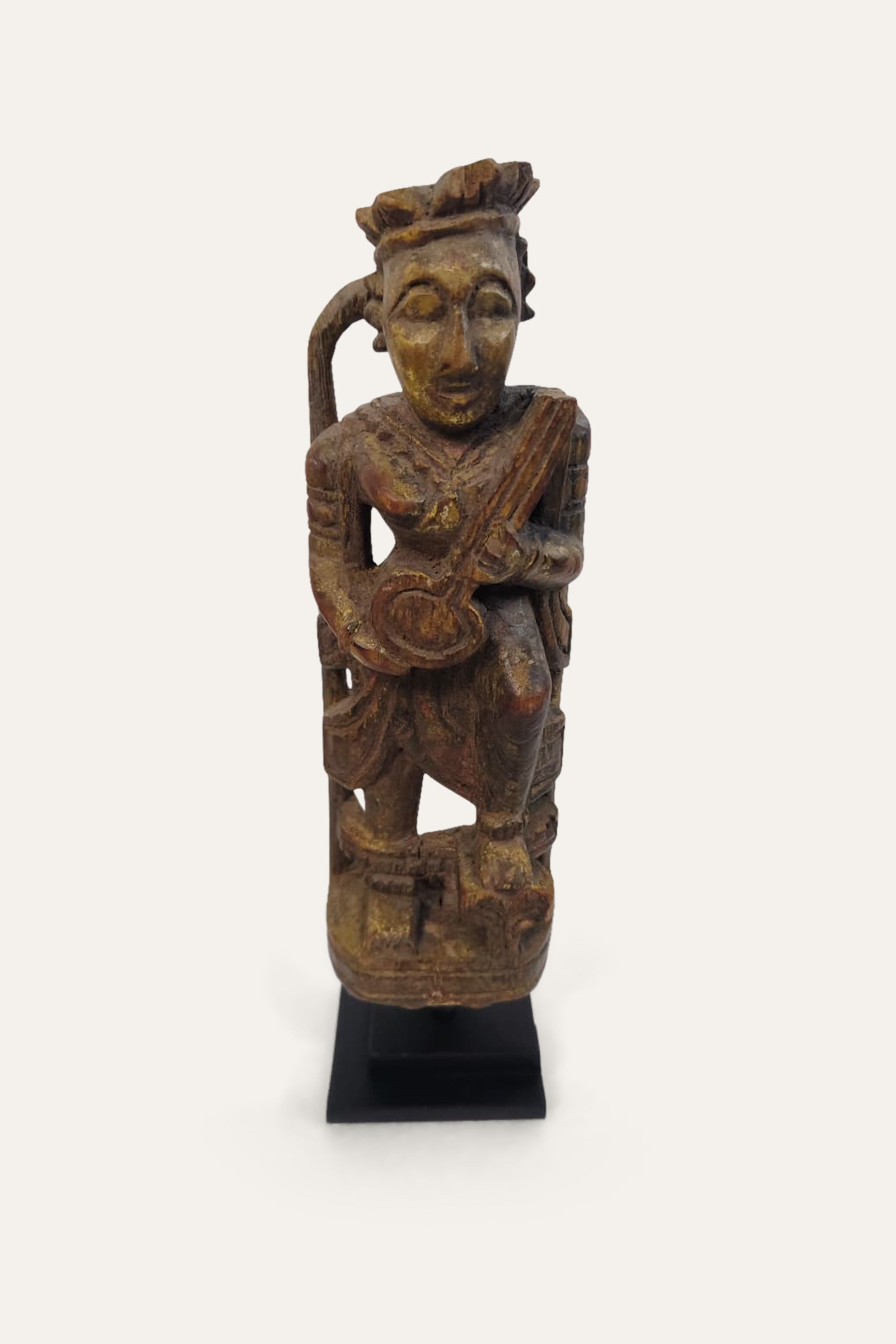 Carved Indian Music Man Figure on Display Stand