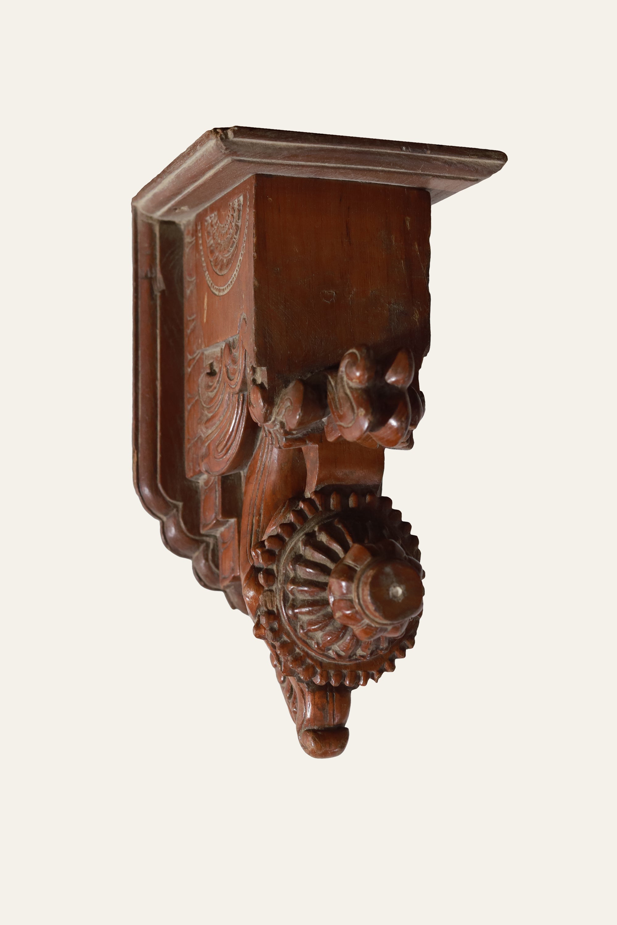 carved wooden scrollwork wall bracket