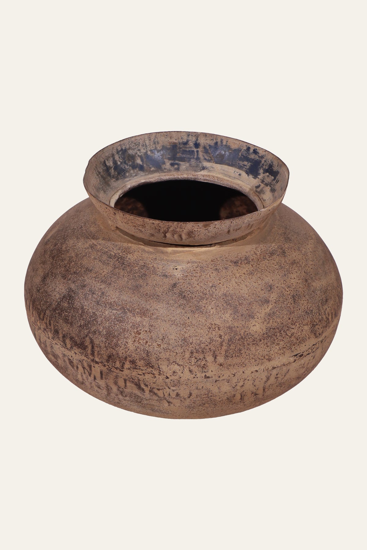 distressed light brown metal pot