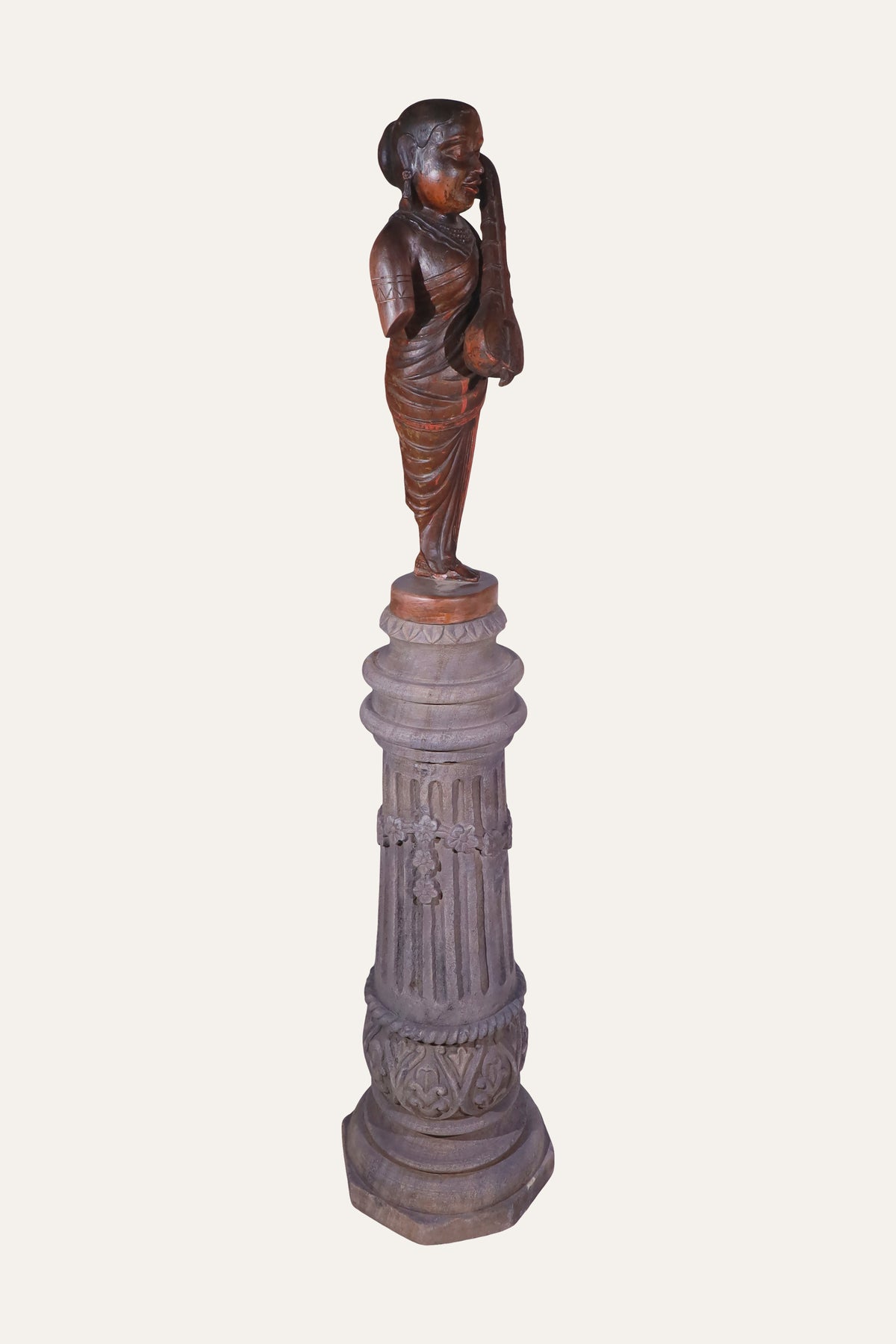 figurine on pedestal