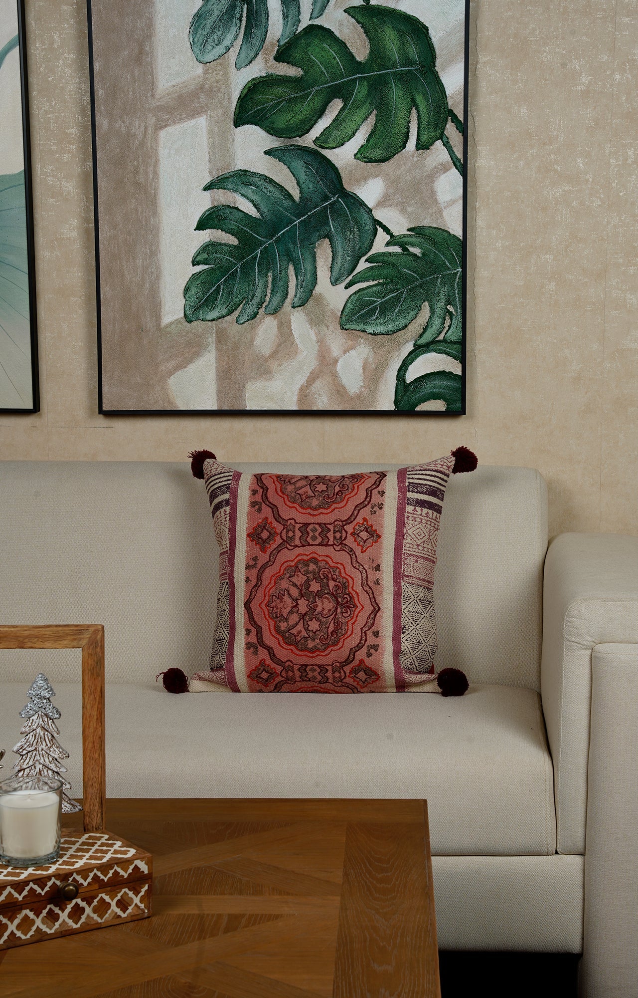 Intricate Patterned Cushion with Pom-Pom Accents