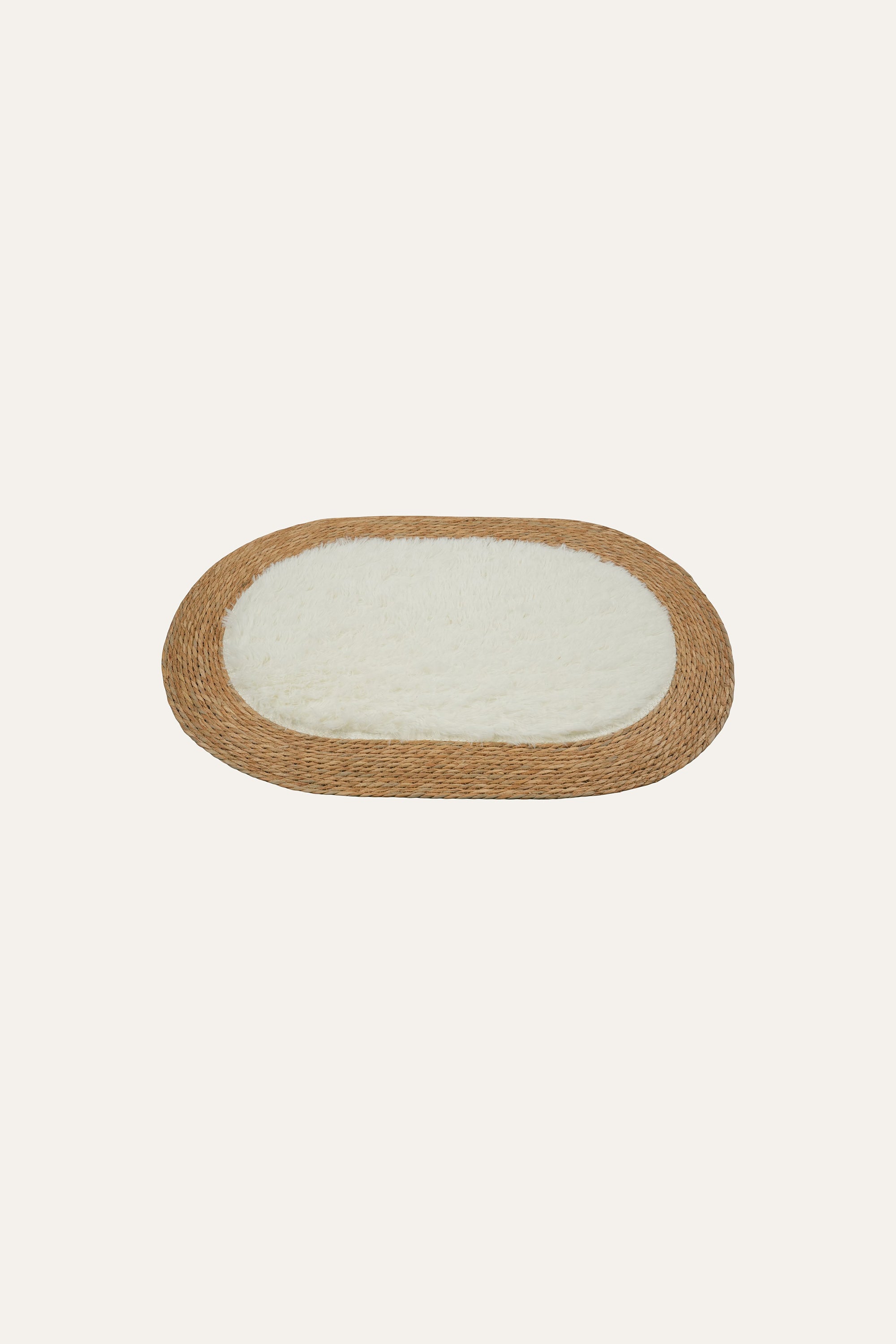Handwoven oval natural fiber floor mat