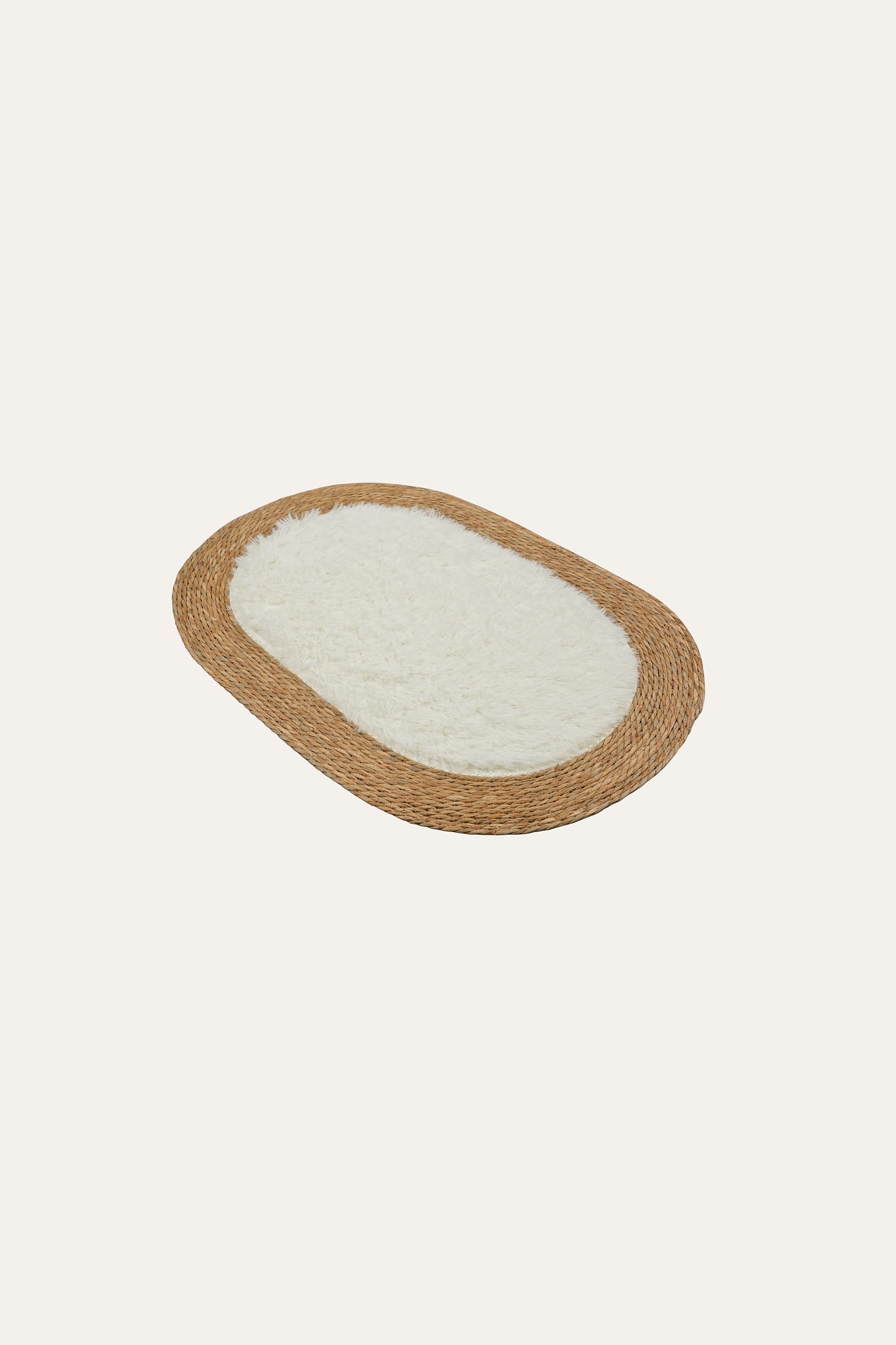 oval woven rug for bedside styling