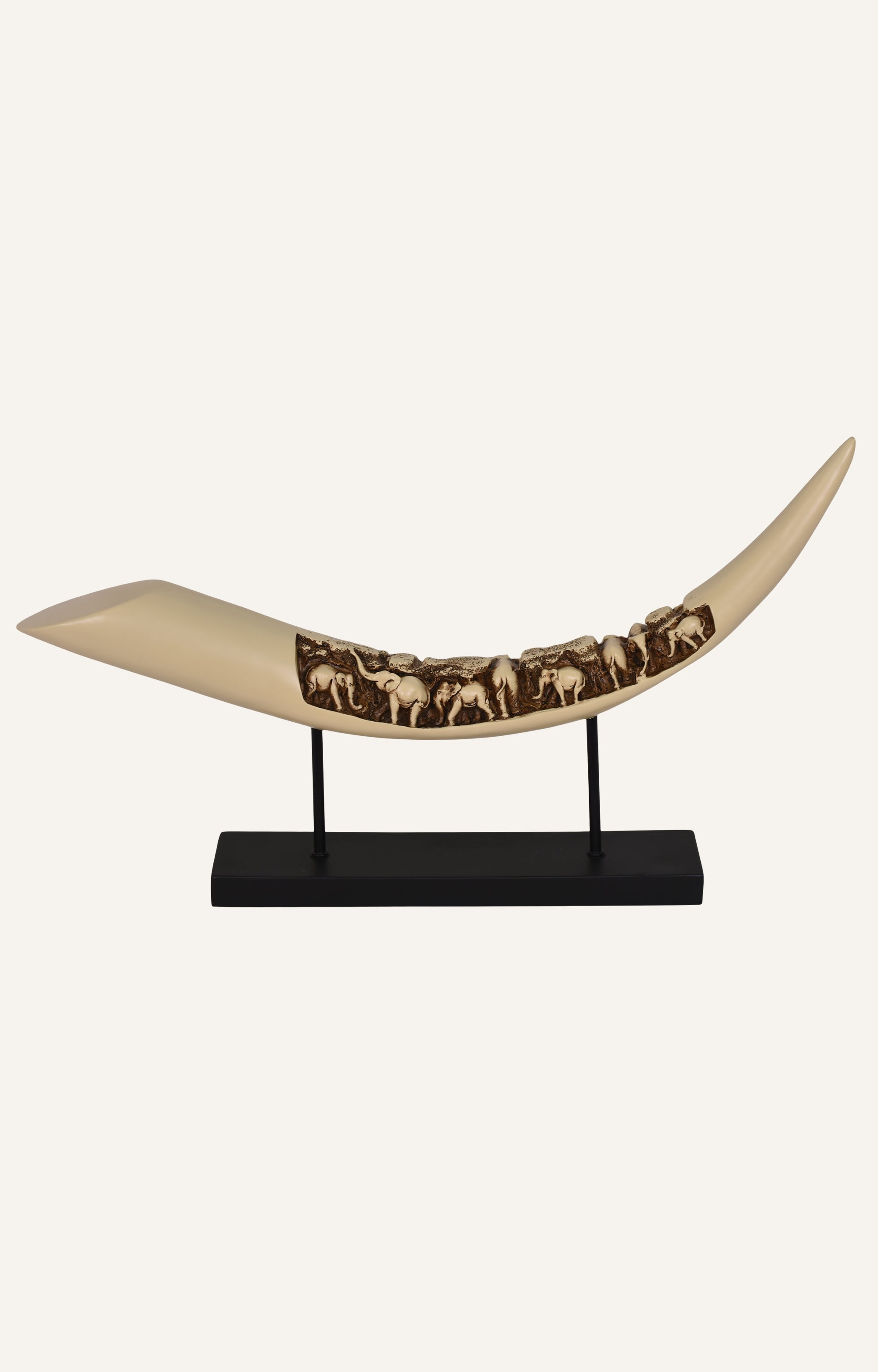resin tusk sculpture on stand