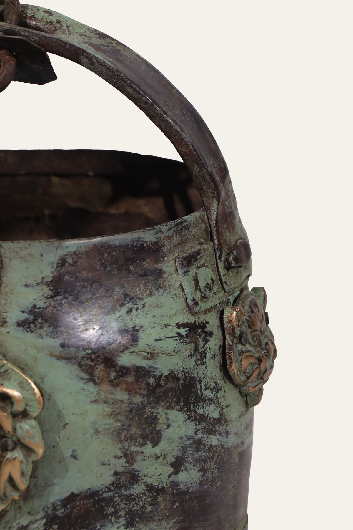 small metal pot with lion head handles