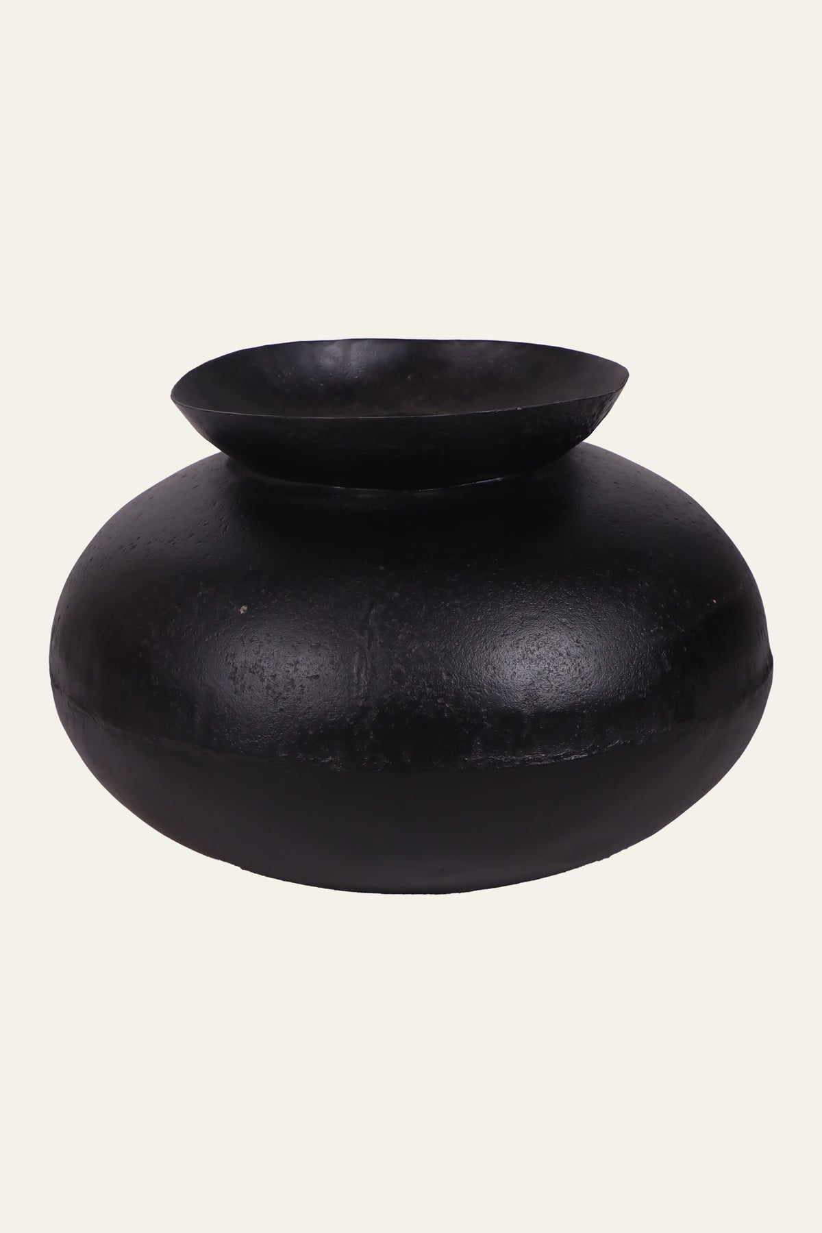 textured black decorative metal vessel